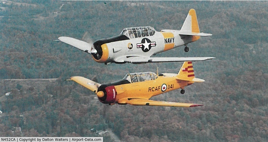 N452CA, 1952 Canadian Car & Foundry Harvard MK IV C/N CCF4-132, Flying in formation with N3685F over western NC - early 1990s.
