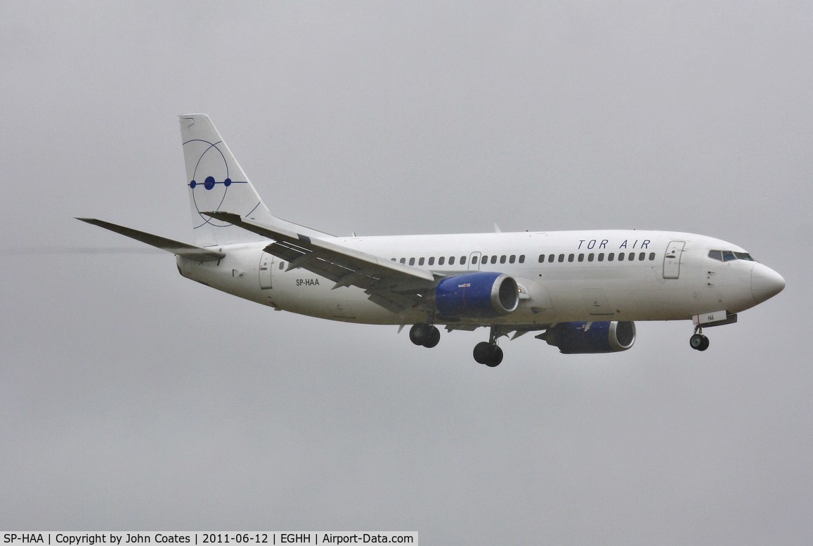 SP-HAA, 1990 Boeing 737-322 C/N 24664, About to land in wet and windy weather