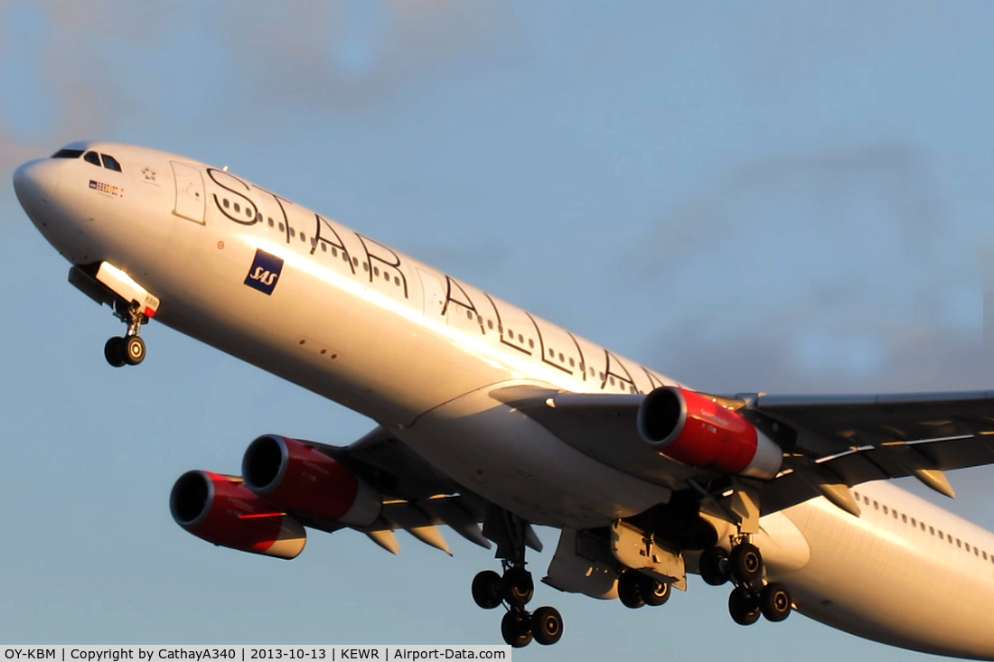 OY-KBM, 2002 Airbus A340-313X C/N 450, Takeoff on Runway 4L in the sunset