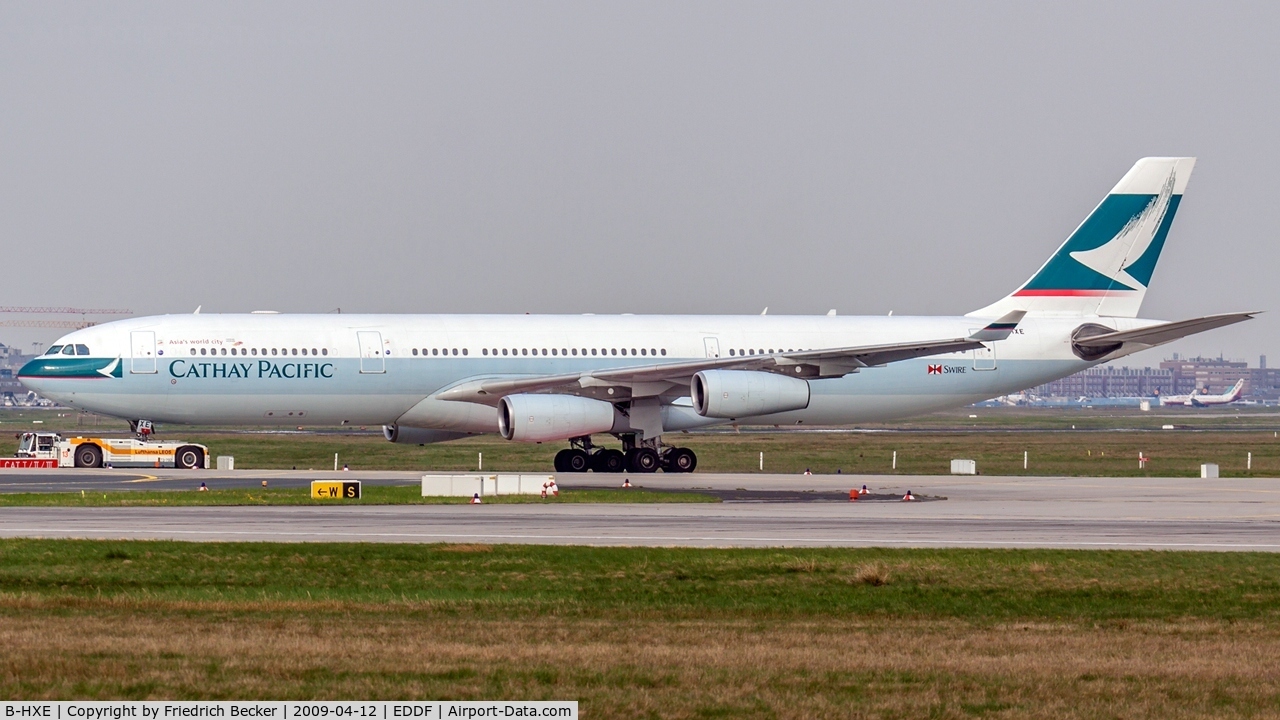 B-HXE, 1996 Airbus A340-313 C/N 157, towed to the gate