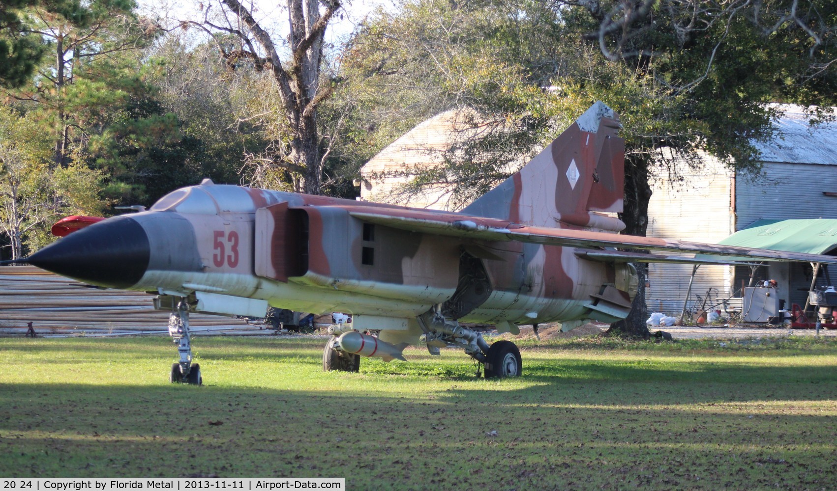 20 24, Mikoyan-Gurevich MiG-23 C/N Not found 20 24, Ex East GermanMig-23 in the front yard of a small construction company up in Baker Galliver FL in the Pan Handle 