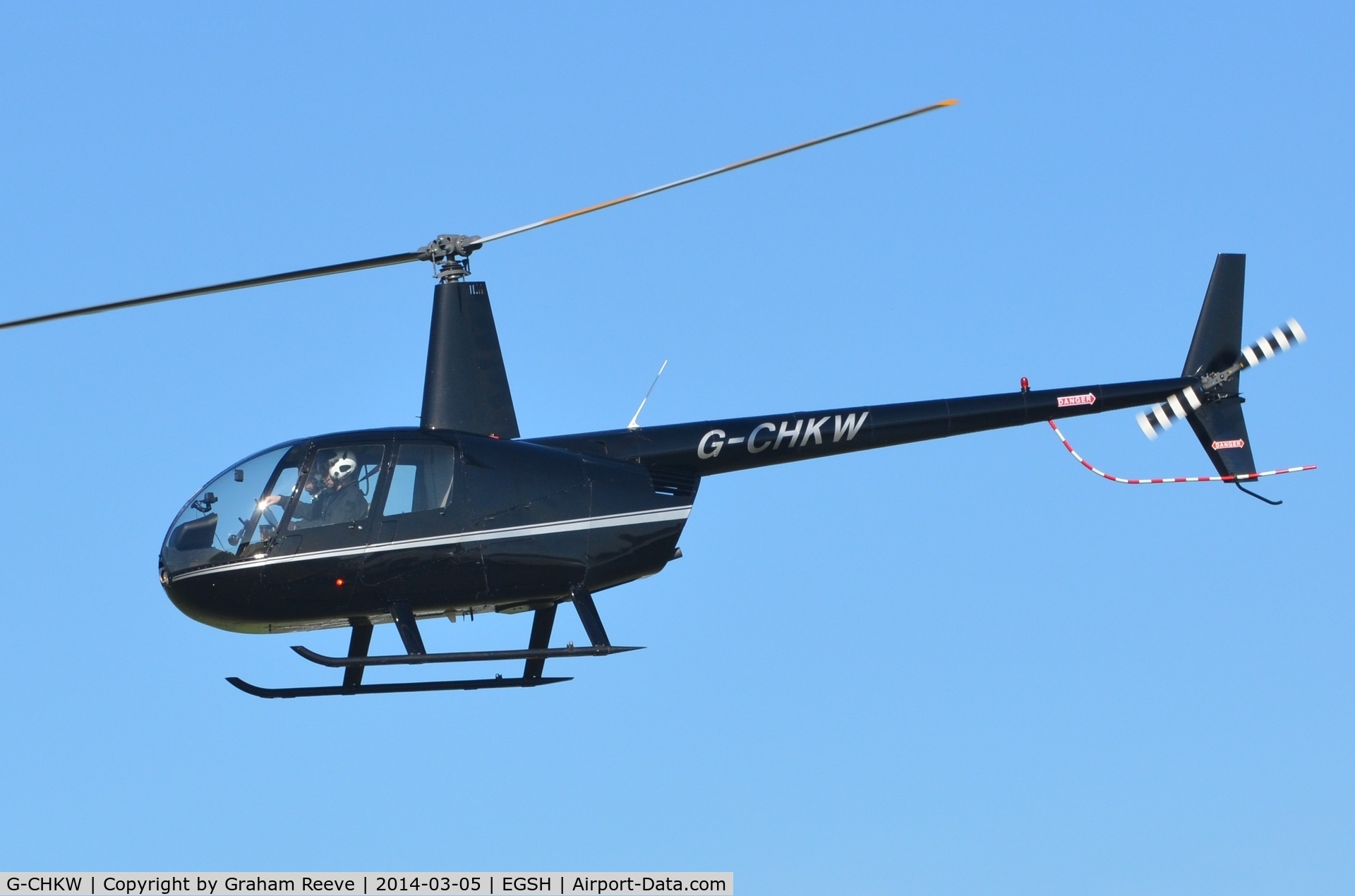 G-CHKW, 2005 Robinson R44 Raven I C/N 1504, Departing from Norwich.