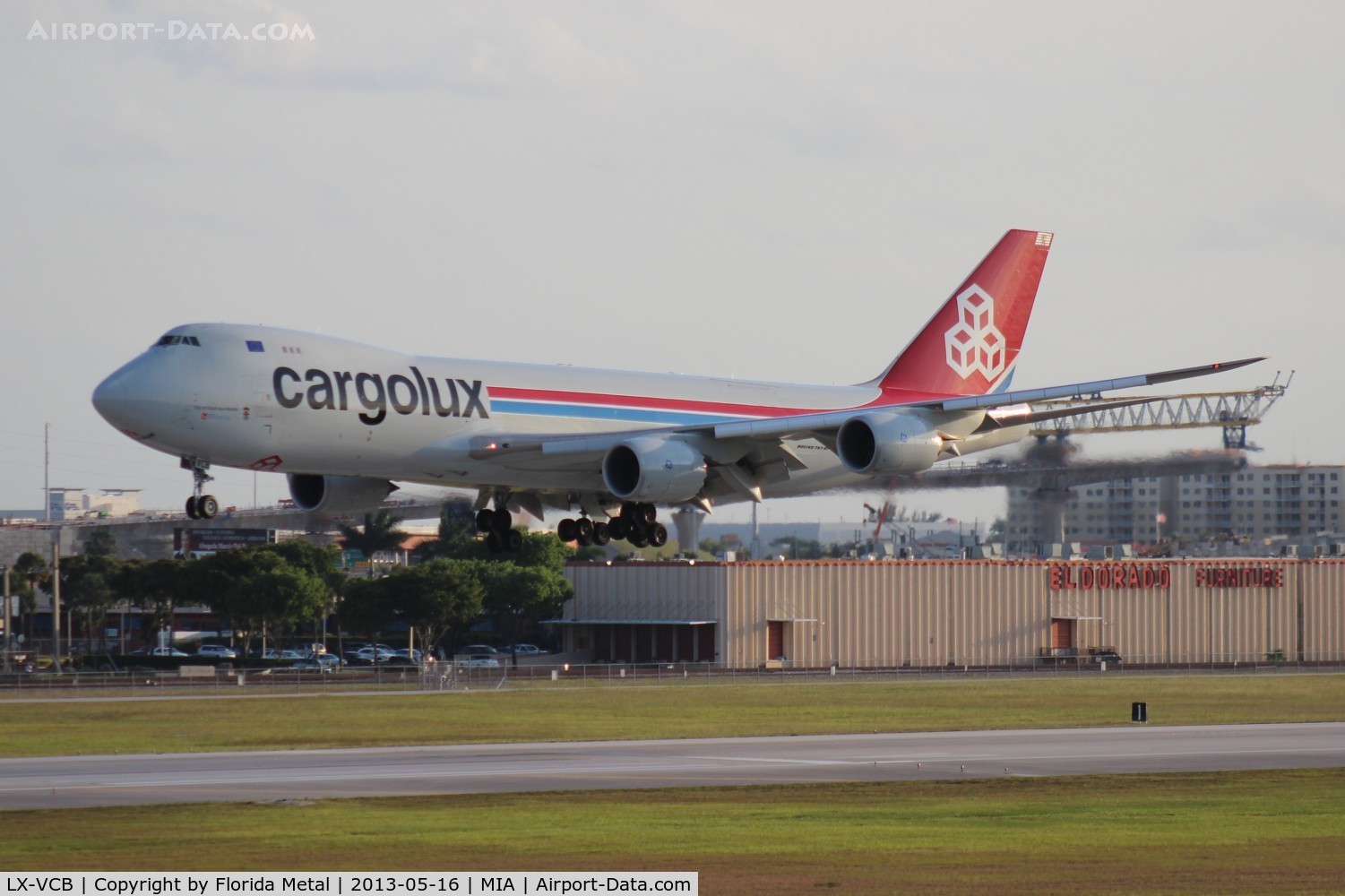 LX-VCB, 2010 Boeing 747-8R7F C/N 35806, Cargolux 747-800 with the famous El Dorado Furniture building in the background, where a majority of MIA arrival shots are taken from