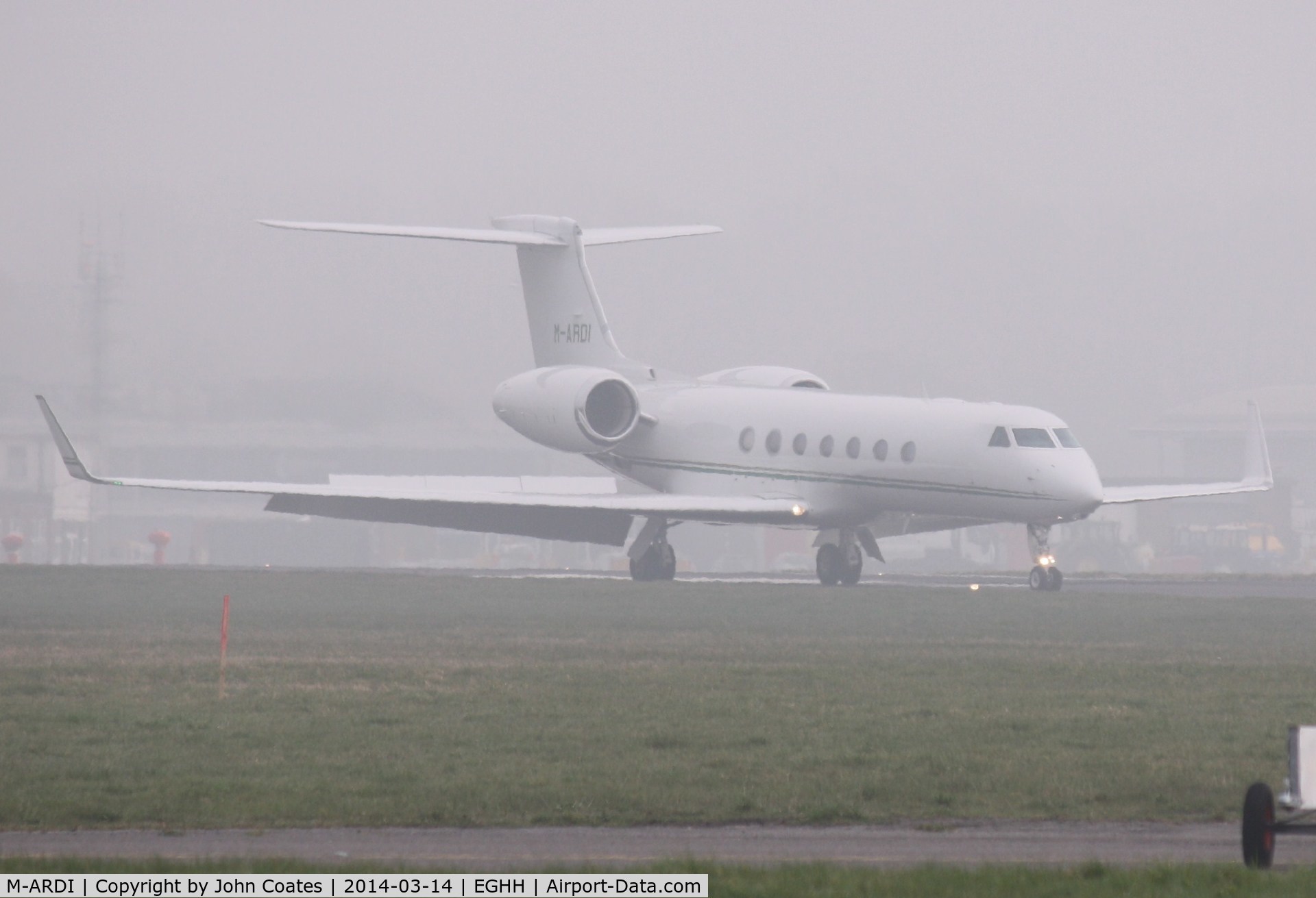 M-ARDI, 2006 Gulfstream Aerospace GV-SP (G550) C/N 5153, Arriving through the fog.