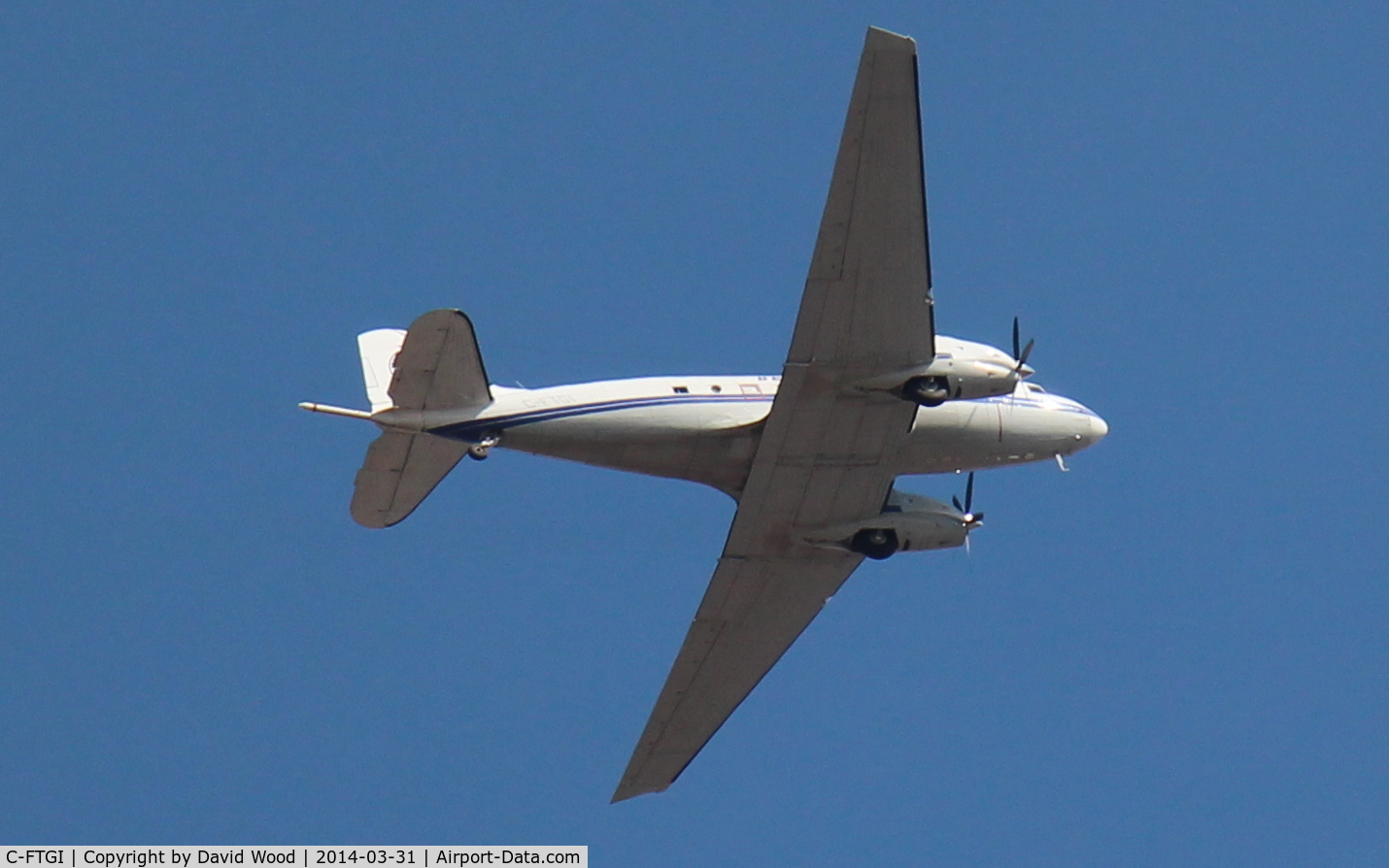 C-FTGI, 1944 Basler BT-67 C/N 26268, Beautiful plane!  This one flew over me twice just after 15:00 Hrs EDT on March 31st, 2014... this was the second pass.  This shot was taken in Whitby Ontario, and was likely heading into the Oshawa Airport.