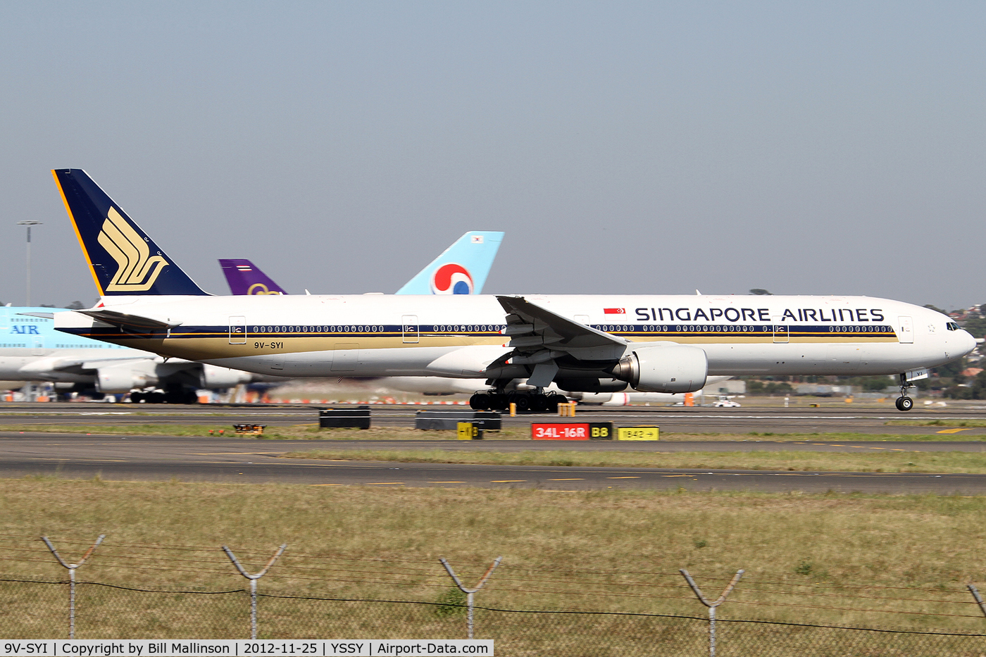 9V-SYI, 2004 Boeing 777-312 C/N 32327, rotating from 34L