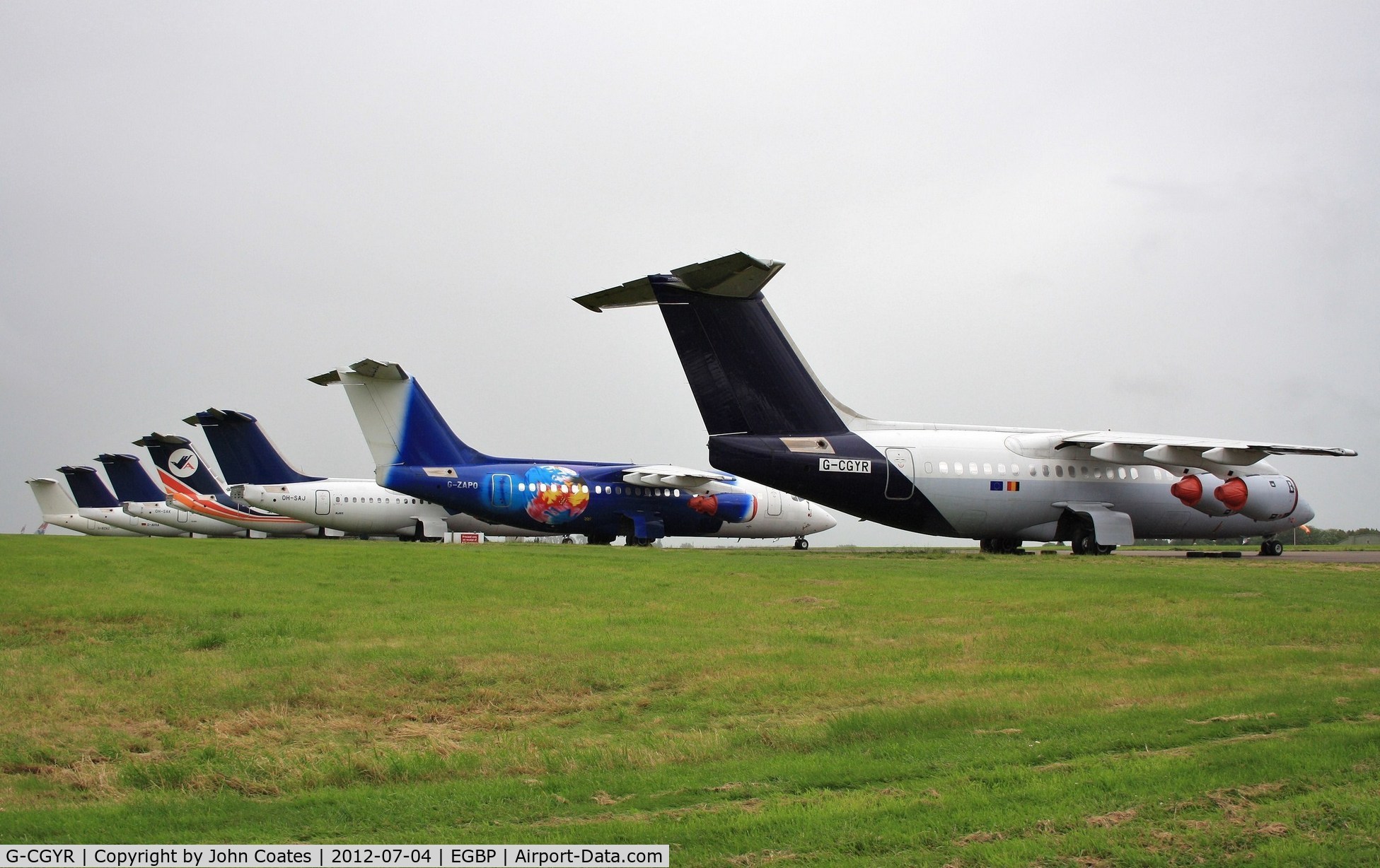 G-CGYR, 1995 British Aerospace Avro 146-RJ85 C/N E.2273, Line of stored 146s include G-ZAPO, OH-SAJ, G-CFSM, OH-SAK etc