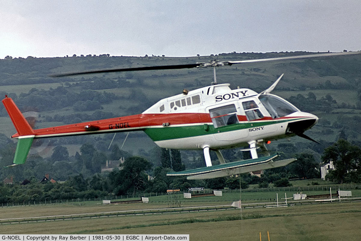 G-NOEL, 1975 Agusta AB-206B JetRanger II C/N 8435, Agusta-Bell AB.206B Jet Ranger II [8435] Cheltenham Racecourse~G 30/05/1981. Seen here being flown  by Noel Edmunds at this fun day. Taken from a slide.