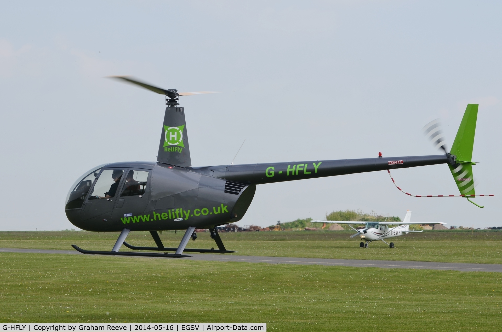 G-HFLY, 2007 Robinson R44  Raven II C/N 11876, About to touch down.