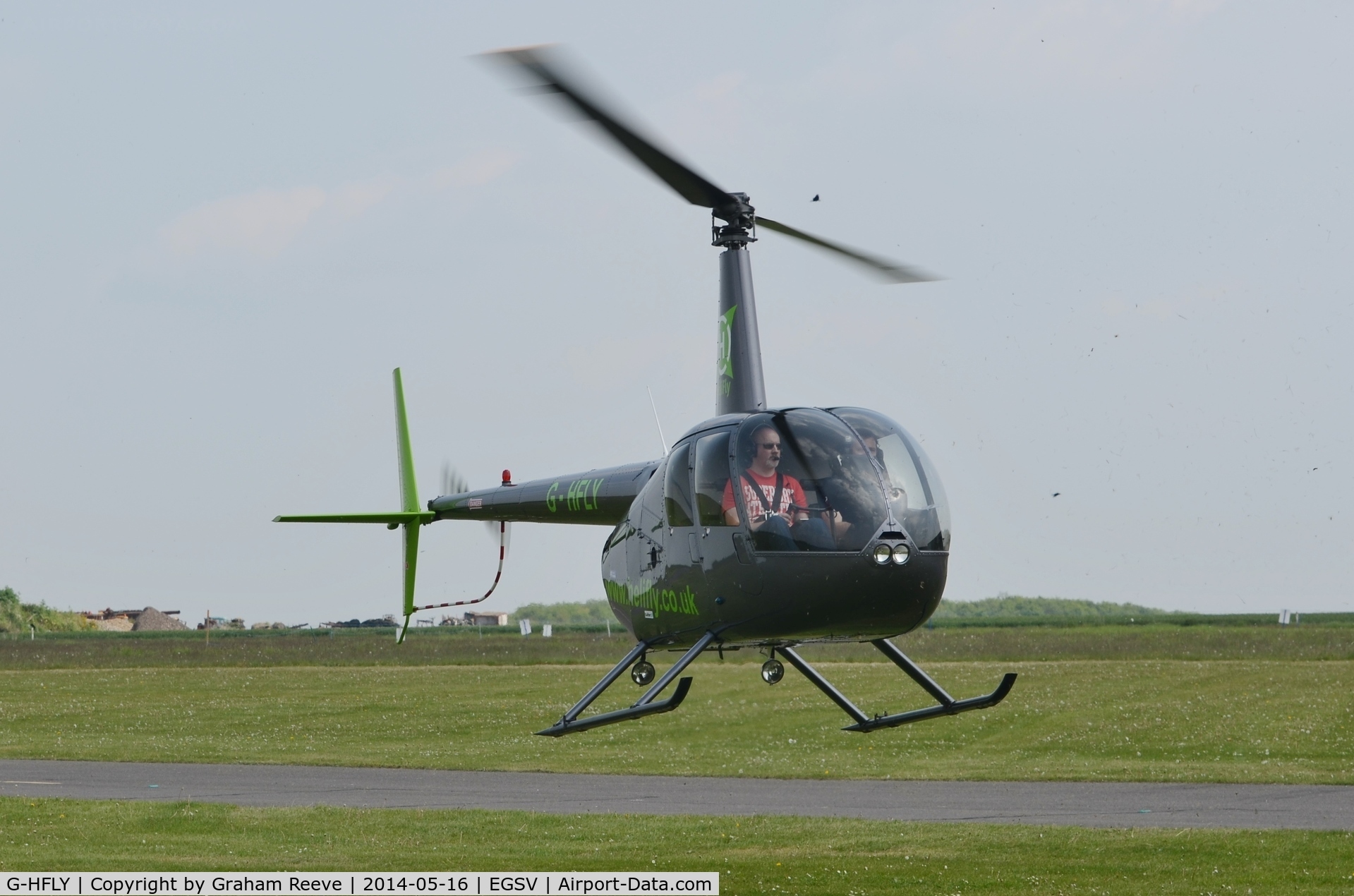 G-HFLY, 2007 Robinson R44  Raven II C/N 11876, About to land.