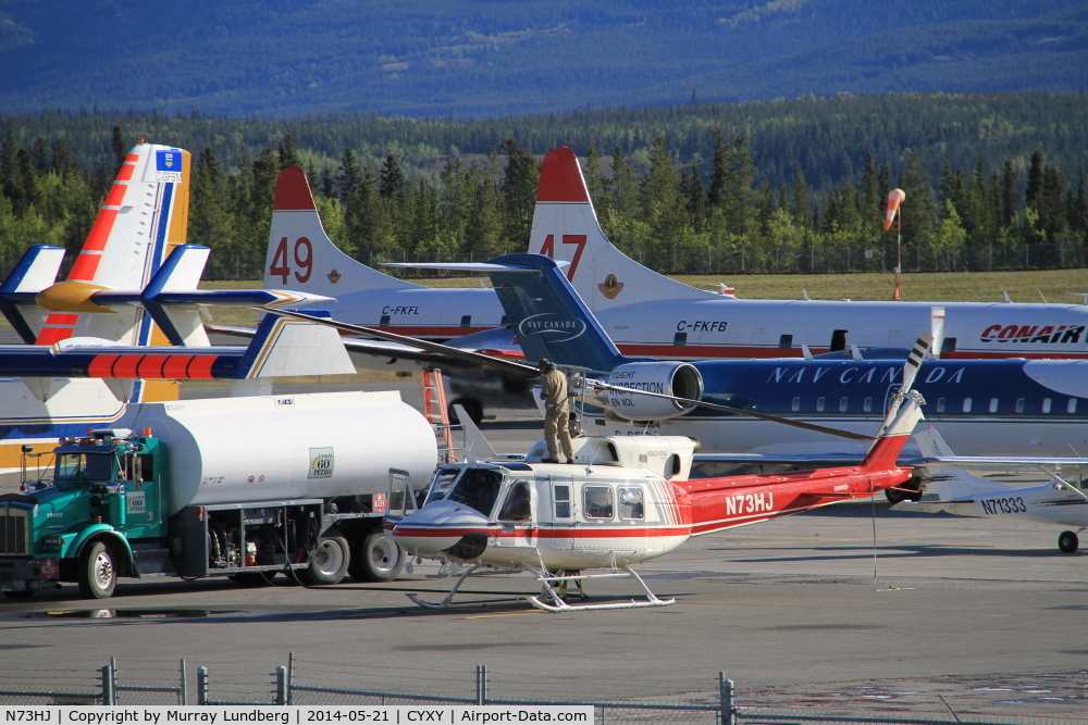 N73HJ, 1972 Bell 212 C/N 30552, Fueling up on the very busy ramp at Whitehorse, Yukon, with water bombers headed to Alaska to help fight the Funny River fire.