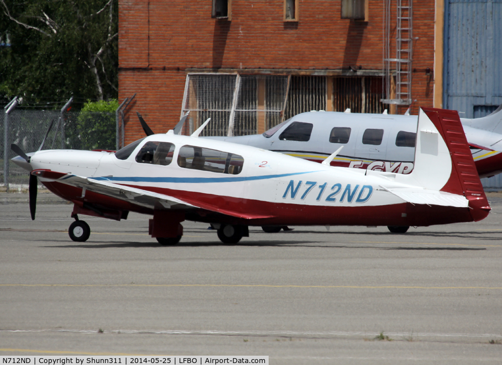 N712ND, 2005 Mooney M20R Ovation C/N 29-0413, Parked at the General Aviation area...
