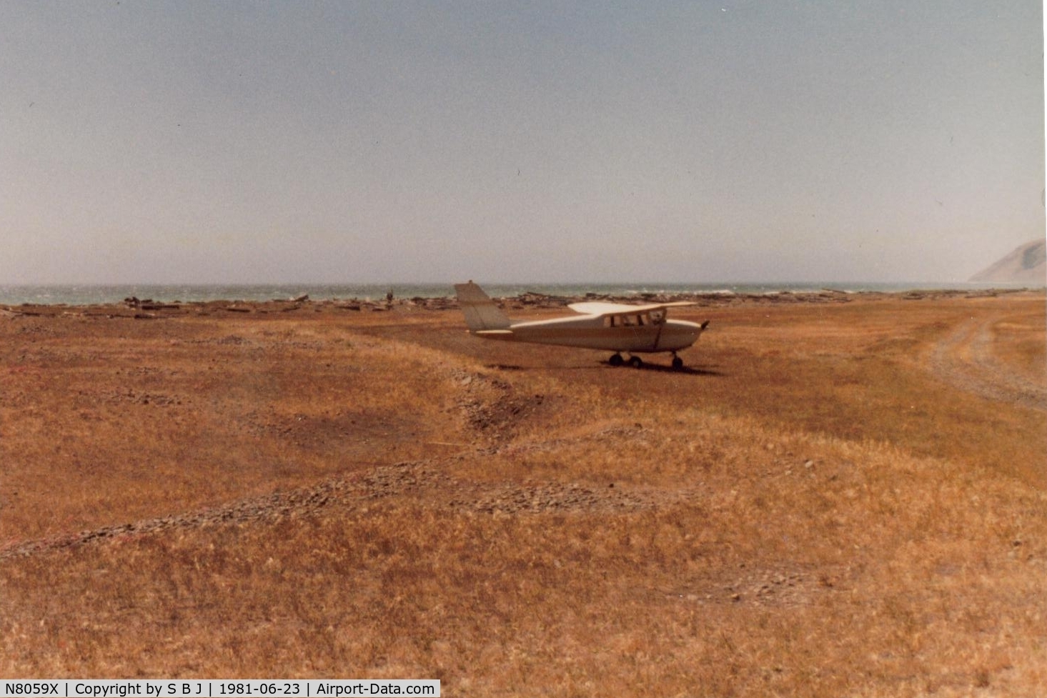 N8059X, 1961 Cessna 172B C/N 17248559, 59X at Big Flat (6 miles north of Shelter Cove,Ca) in 1981.Was used by many pilots for fly ins & camping until it became a national wilderness area known as The Lost Coast. O well.