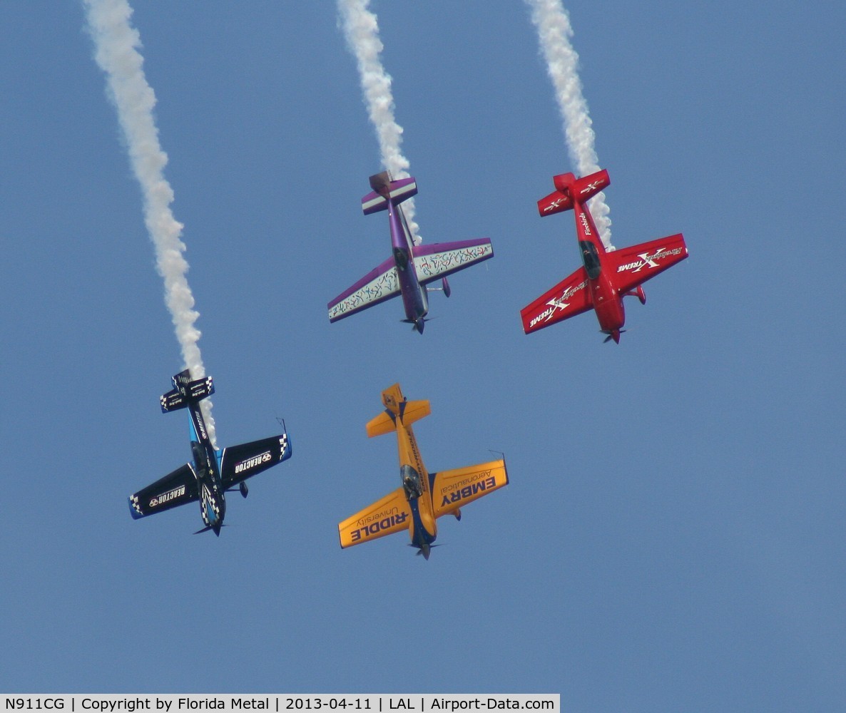 N911CG, 1993 Extra EA-300S C/N 01, Extra EA-300 in formation with other types at Sun N Fun