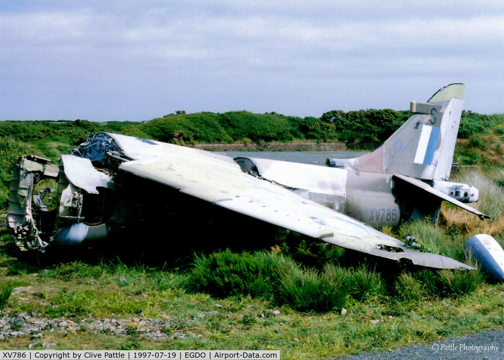 XV786, Hawker Harrier GR.3 C/N 712036, Scanned from a print. The remnants of Harrier GR.3 XV786 lie in the Fire Training School at Predannack, Cornwall in 1997. Coded 'S' this a/c had been in use at the SFDO at nearby RNAS Culdrose
