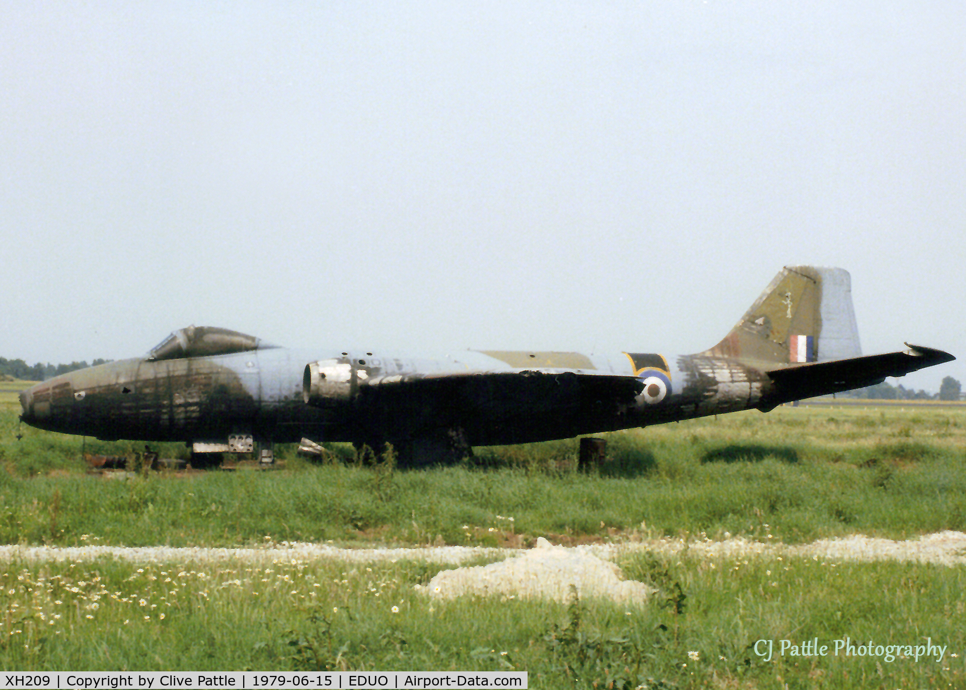 XH209, 1956 English Electric Canberra B(1).8 C/N Not found XH209, Scanned from print. Partly singed EE Canberra XH209 on the dump at RAF Gutersloh in June '79, its services no longer required as a decoy at the airfield. An ex 16 Sqn RAF machine - you can see the 'Saint' image on the tail.