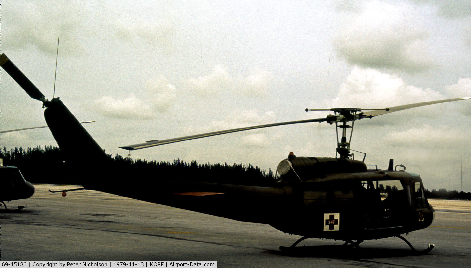 69-15180, 1969 Bell UH-1H Iroquois C/N 11468, UH-1H Iroquois of 347th Medical Detachment on the ramp at Opa Locka in November 1979.