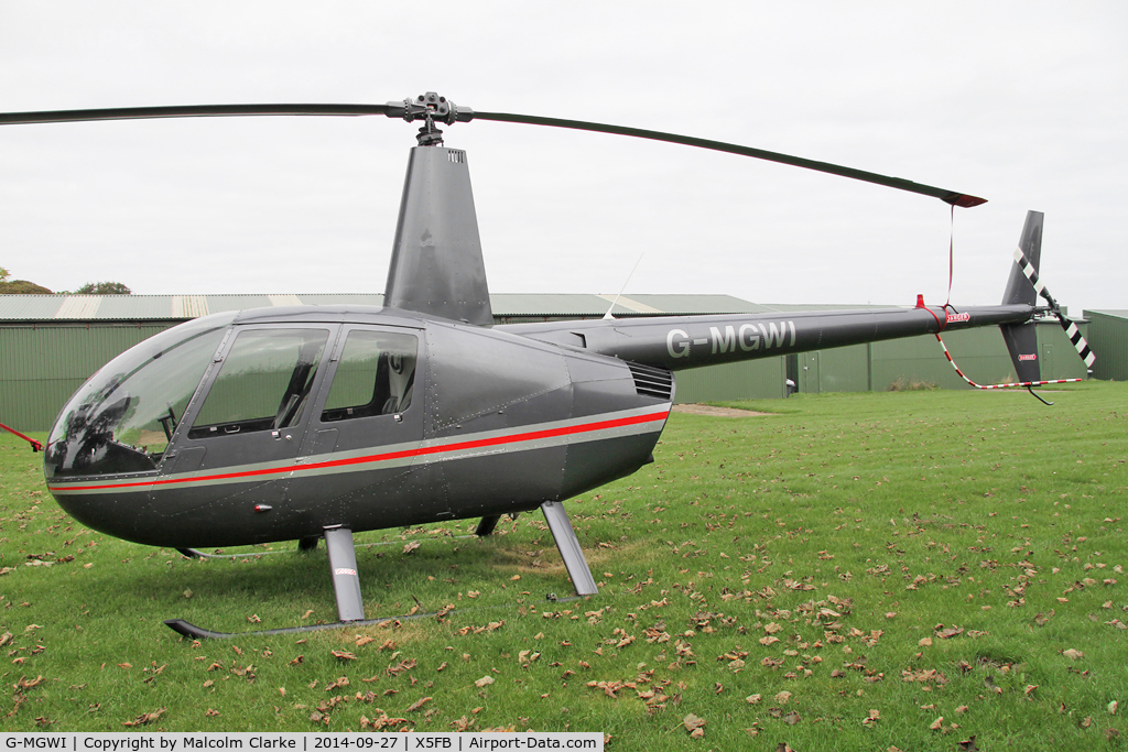 G-MGWI, 2000 Robinson R44 Astro C/N 0663, Robinson R44 Astro, Fishburn Airfield UK, September 27th 2014.