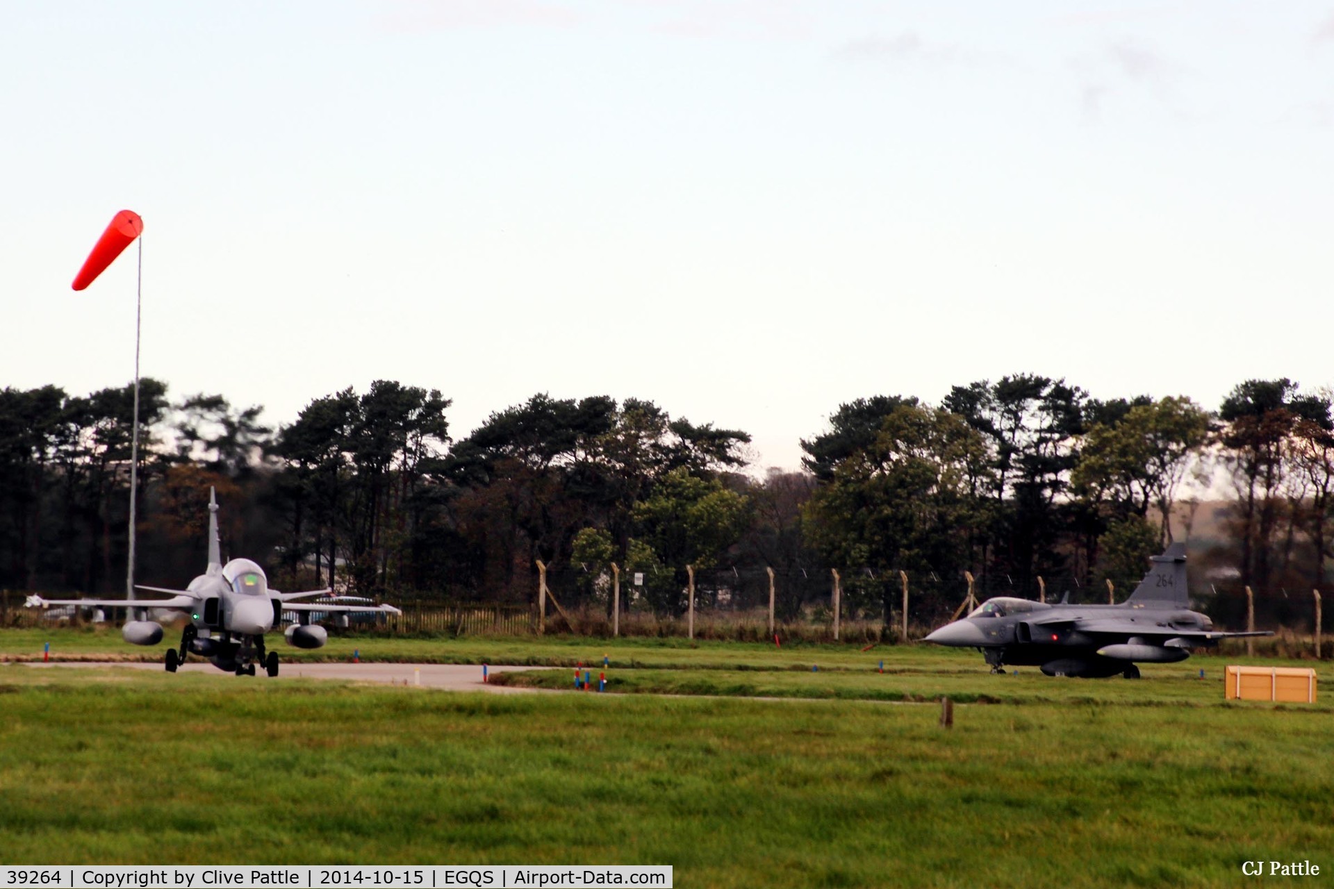 39264, Saab JAS-39C Gripen C/N 39264, Seen (on left) holding at runway 05 at RAF Lossiemouth whilst participating in Exercise Joint Warrior 14-2