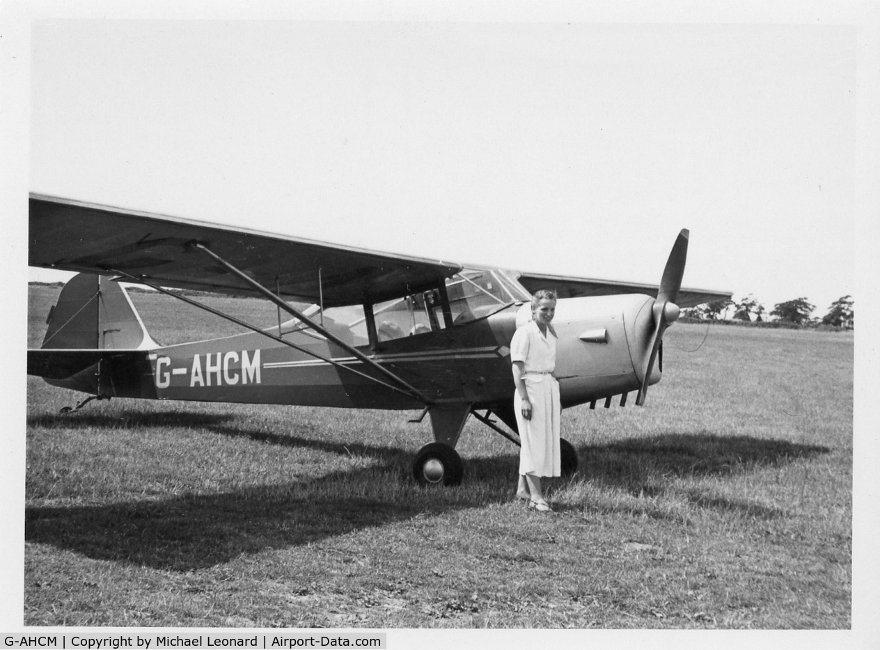 G-AHCM, 1946 Auster J-1N Alpha C/N 1979, This is my mother with the plane owned by a friend. It was taken in about 1949 in England.