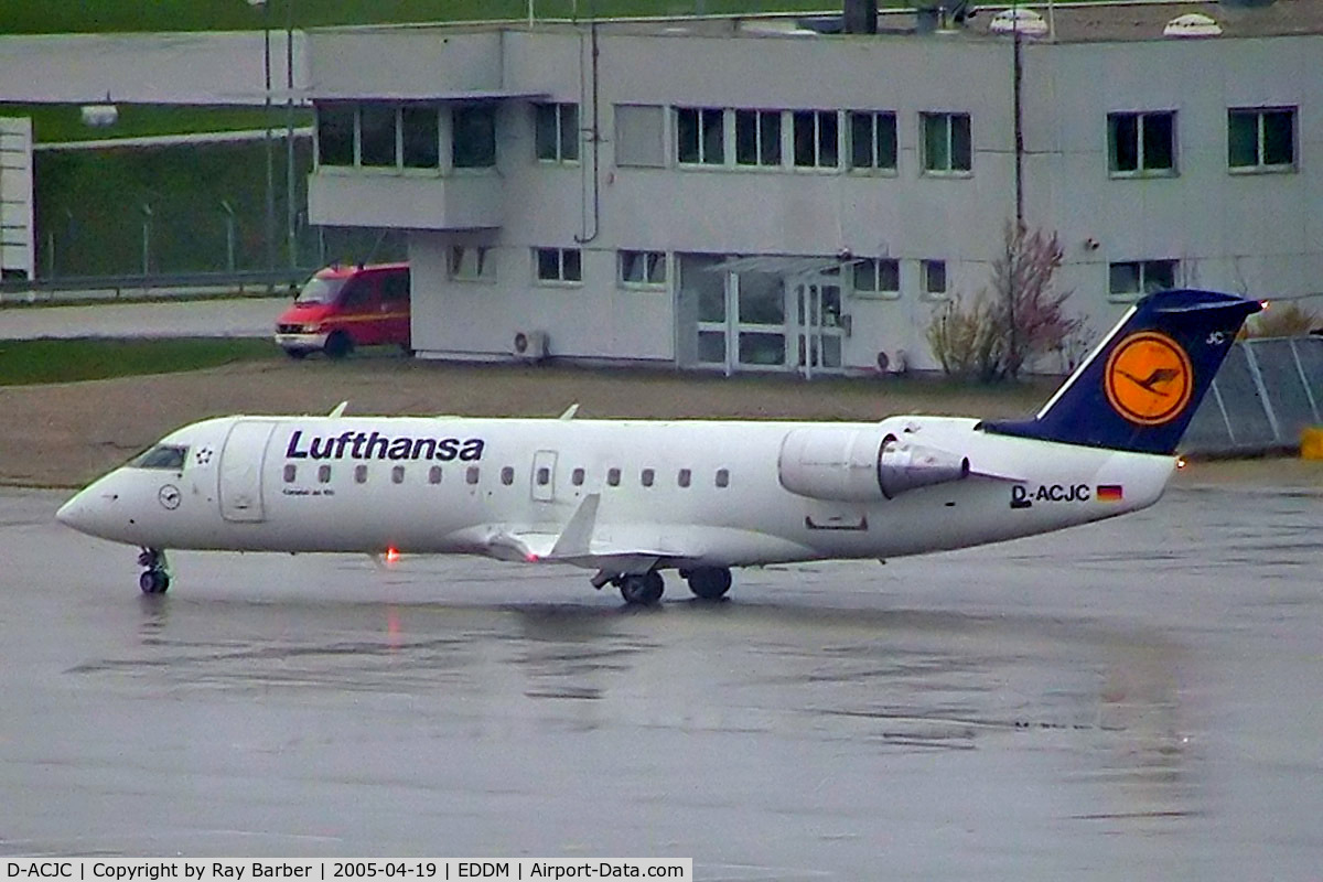 D-ACJC, 1996 Canadair CRJ-100LR (CL-600-2B19) C/N 7130, D-ACRC   Canadair CRJ-100LR [7130] (Lufthansa Regional) Munich-Franz Josef Strauss~D 19/04/2005. Taken during a rain storm.