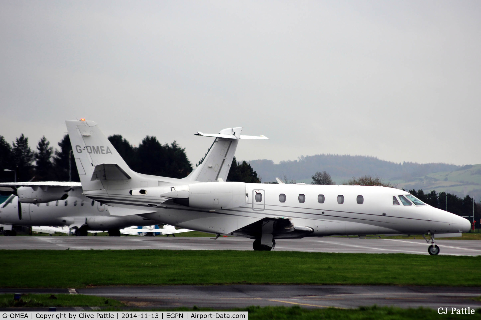 G-OMEA, 2006 Cessna 560XL Citation XLS C/N 560-5610, On the ramp at Dundee Riverside airport EGPN on a wet November day.