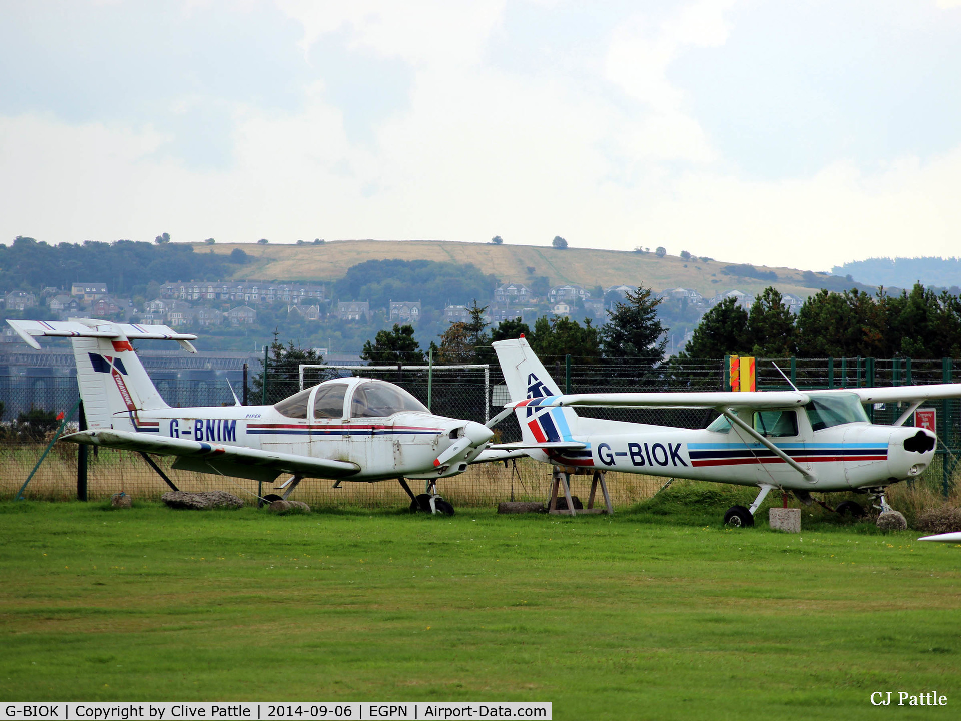 G-BIOK, 1981 Reims F152 C/N 1810, Two occupants in the airfield graveyard at Dundee Riverside Airport EGPN - G-BNIM and BIOK - update June 2015 both aircraft are now gone - destination unknown - scrapyard ?