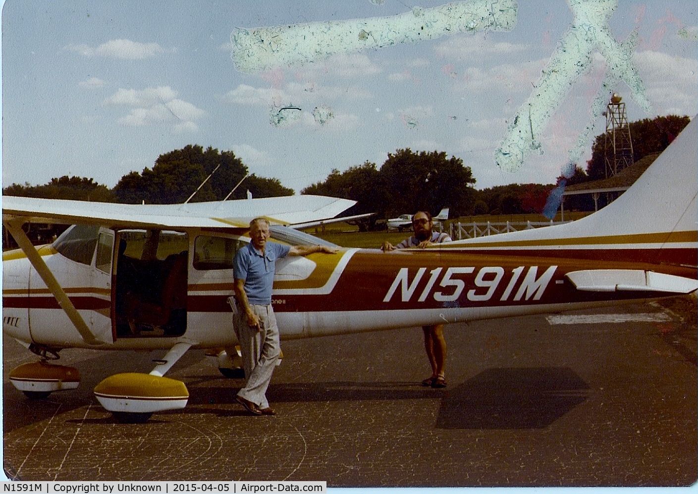 N1591M, Cessna 182P Skylane C/N 18264381, At one time, this beautiful plane was owned by my Grandfather (on left).  When I saw that there were no pictures, I searched through a life time of photo albums and found these two.  I hope they are accepted!
