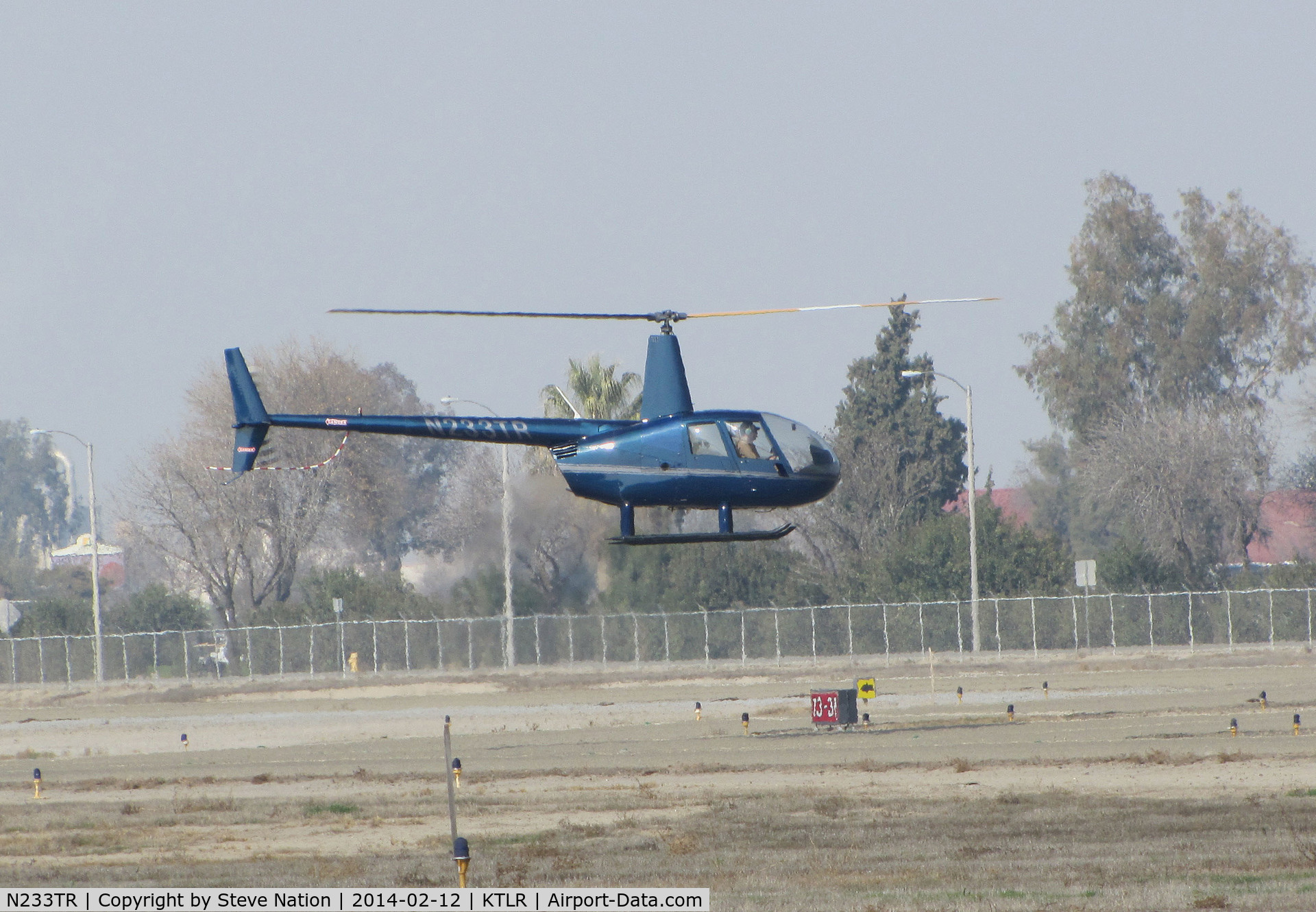 N233TR, 2003 Robinson R44 Raven II C/N 10062, Sierra Flite Robinson R44 II @ Mefford Field (Tulare, CA) for helicopter rides over the 2014 International Ag Expo
