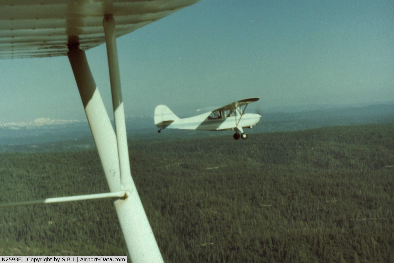 N2593E, 1946 Aeronca 7AC Champion C/N 7AC-6175, 93E with 78E as we fly west near Placerville,Ca. returning from Carson City,Nv. This was the day I decided to sell 93E.My old Chief 78E (owned 3 times)badly outperformed 93E which I found disappointing.The Sierras do test an airplane!!!