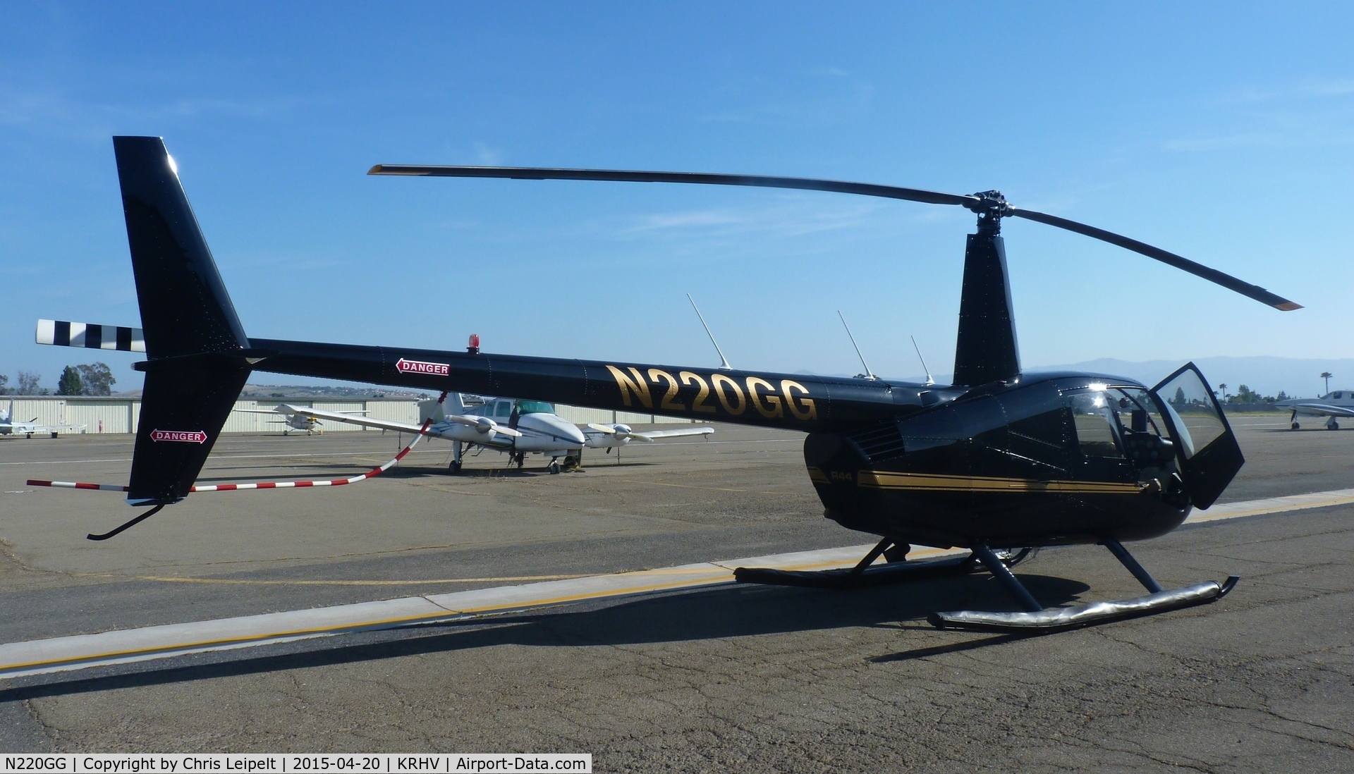 N220GG, 2009 Robinson R44 II C/N 12820, A local 2009 Robinson R44 II sitting in front of its hangar at the south tie downs at Reid Hillview Airport, CA.