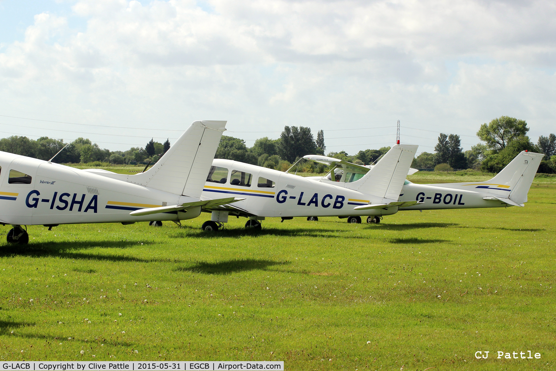G-LACB, 1982 Piper PA-28-161 Cherokee C/N 28-8216035, In amongst a line-up at the GA parking area at Barton Airfield, Manchester - EGCB