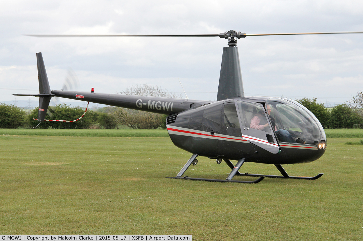 G-MGWI, 2000 Robinson R44 Astro C/N 0663, Robinson R44 Astro at the opening of Fishburn Airfield's new clubhouse, May 17th 2015.