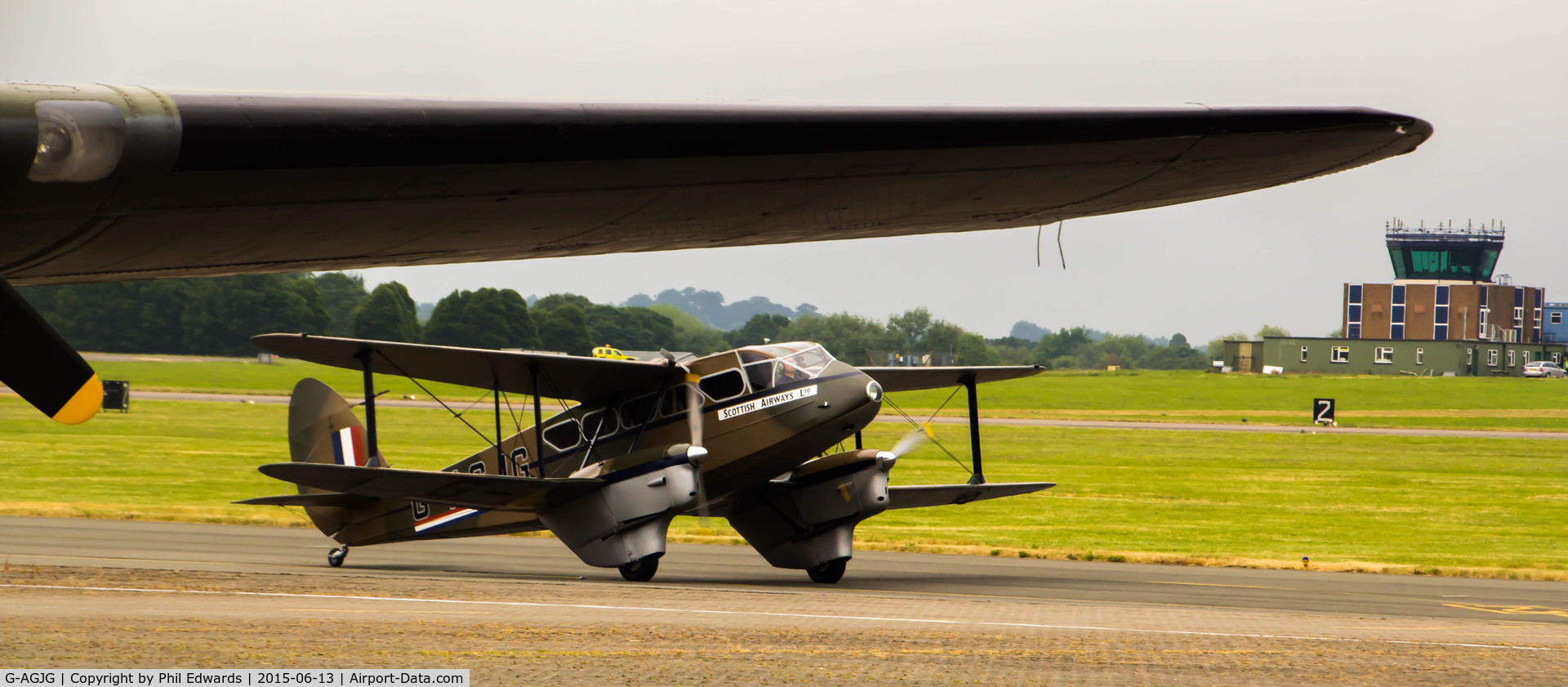 G-AGJG, 1941 De Havilland DH-89A Dominie/Dragon Rapide C/N 6517, G-AGJG - Taking off under the wing of a B17 at Northolt Aerodrome during RAF Northolt Centenary Open Day.