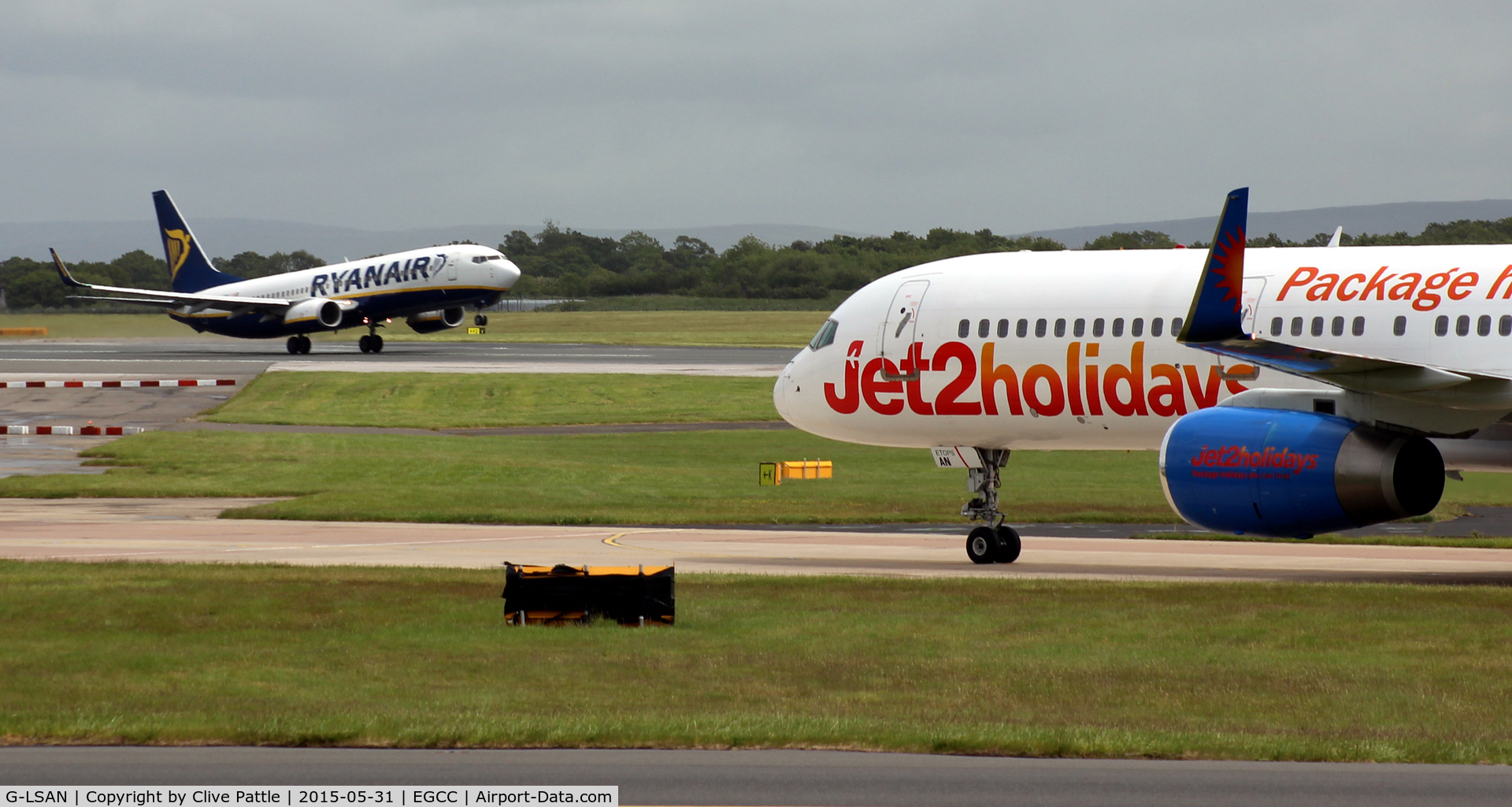 G-LSAN, 1994 Boeing 757-2K2 C/N 26635, In action taxying at Manchester Airport EGCC with background activity