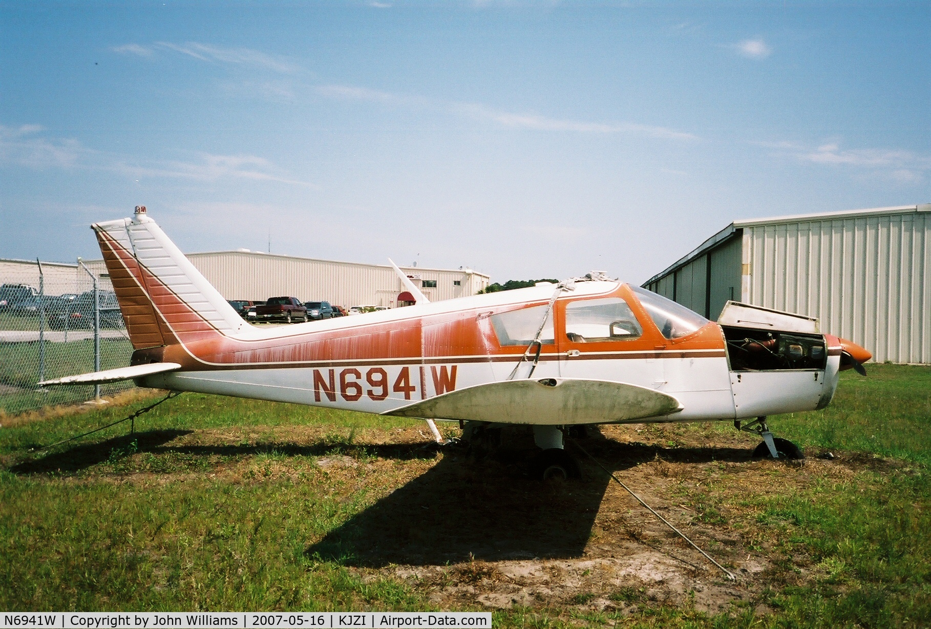 N6941W, 1965 Piper PA-28-140 C/N 28-21167, Sitting out in the weeds at John's Island airport.