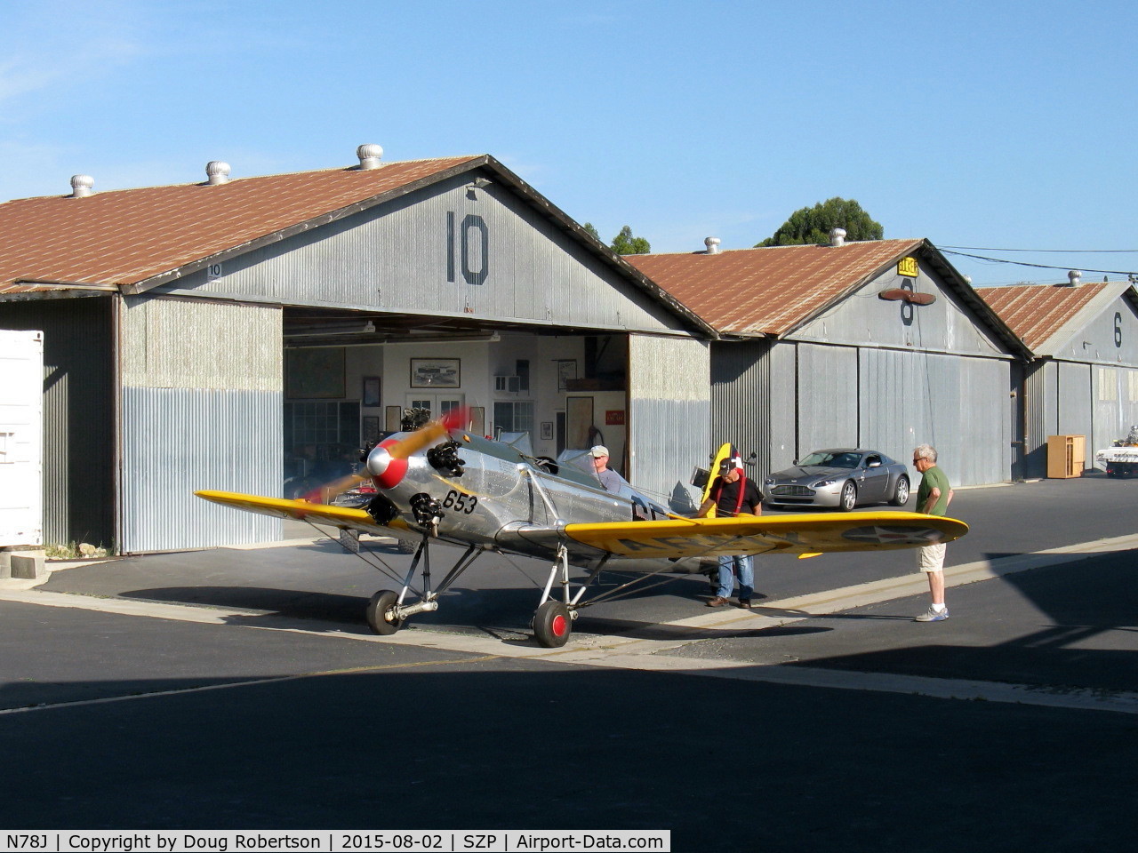 N78J, 1942 Ryan Aeronautical ST3KR C/N 1682, 1942 Ryan Aeronautical ST-3KR as PT-22, Kinner R-5 160 Hp radial, engine warm-up after hand propping start by owner in green shirt.