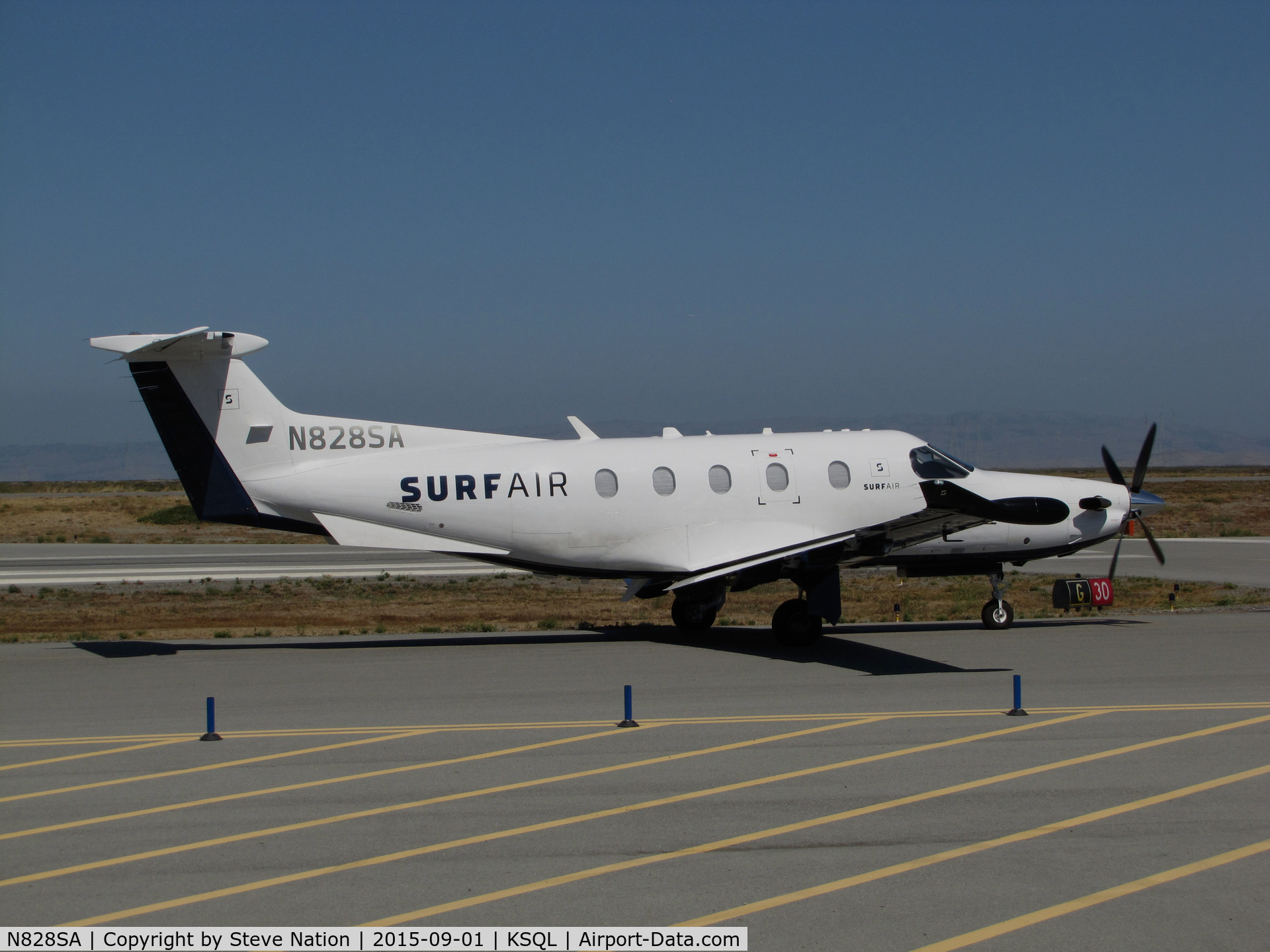 N828SA, 2015 Pilatus PC-12/47E C/N 1525, Surf Airlines PC-12/47E taxiing for take-off to their San Diego Area terminal (KCRQ McClellan-Palomar Airport) @ San Carlos Airport, CA (SF Bay Area terminal)