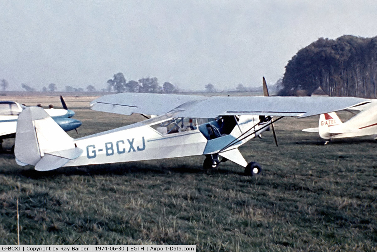 G-BCXJ, 1944 Piper L-4J Grasshopper (J3C-65D) C/N 13048, Piper L-4J Grasshopper [13048] Old Warden~G 30/06/1974. From a slide.