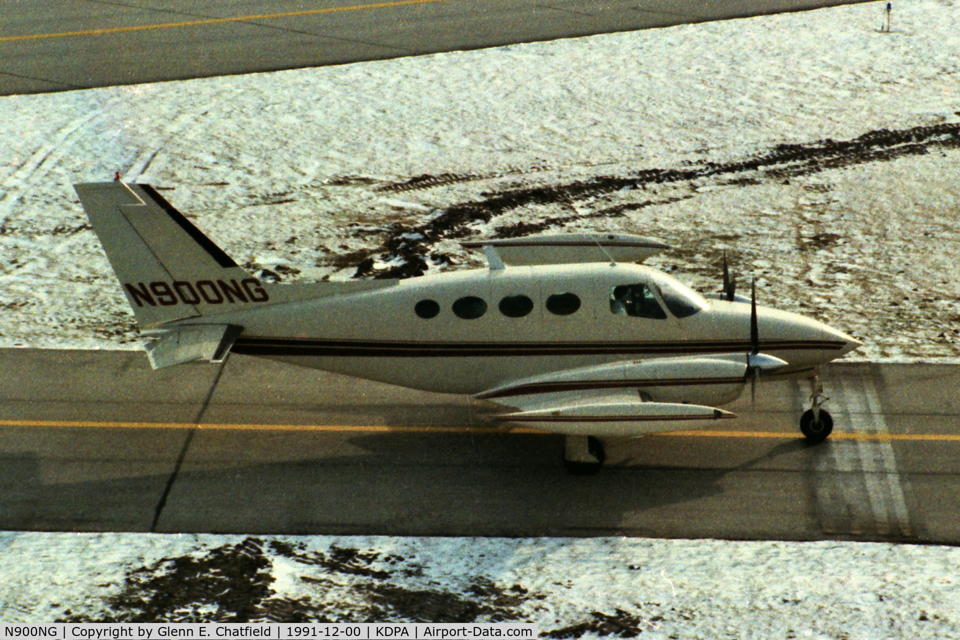 N900NG, 1968 Cessna 411A C/N 411-0287, Taxiing past the control tower.  Scanned negative