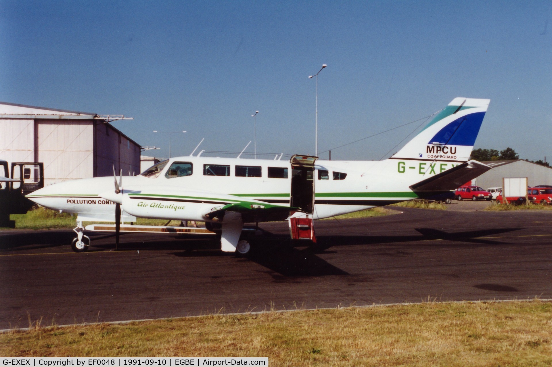 G-EXEX, 1977 Cessna 404 Titan C/N 404-0037, Ready for a marine pollution control mission. Scanned from slide