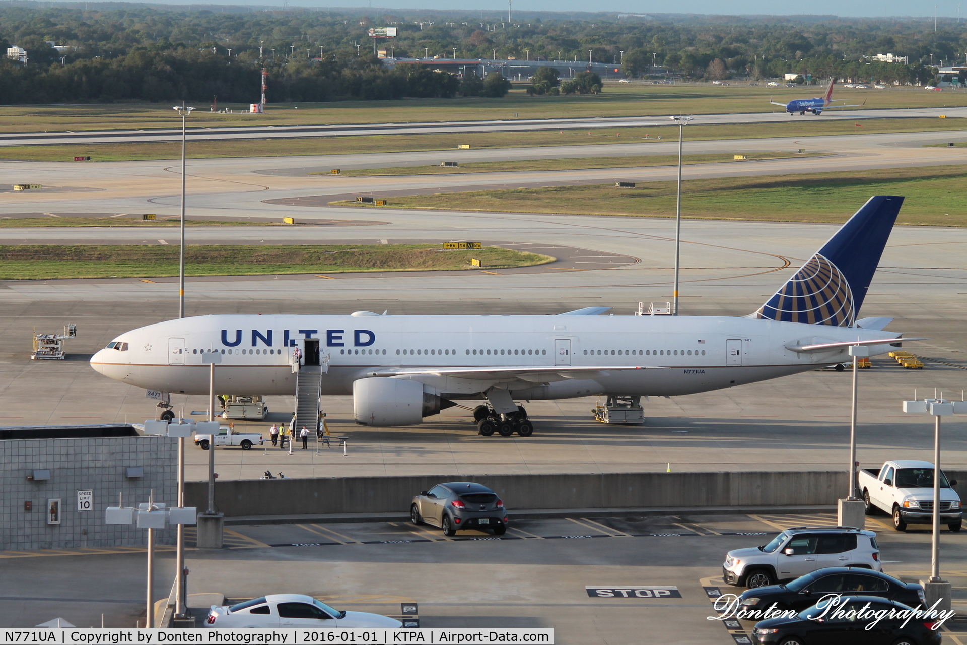 N771UA, 1995 Boeing 777-222 C/N 26932, United Flight 2223 (N771UA) sits on the ramp at Tampa International Airport providing charter service for Northwestern University following the Outback Bowl