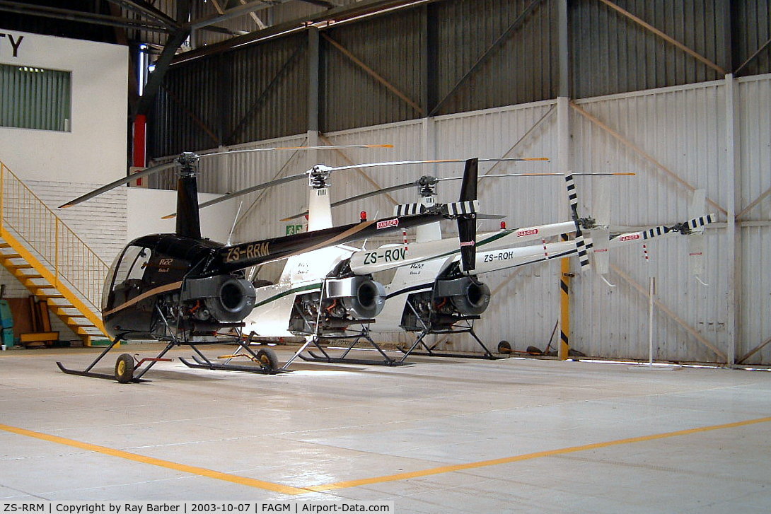 ZS-RRM, Robinson R22 Beta C/N 3481, Robinson R-22 Beta II [3481] Rand~ZS 07/10/2003. Seen here with ZS-ROH and ZS-ROV.
