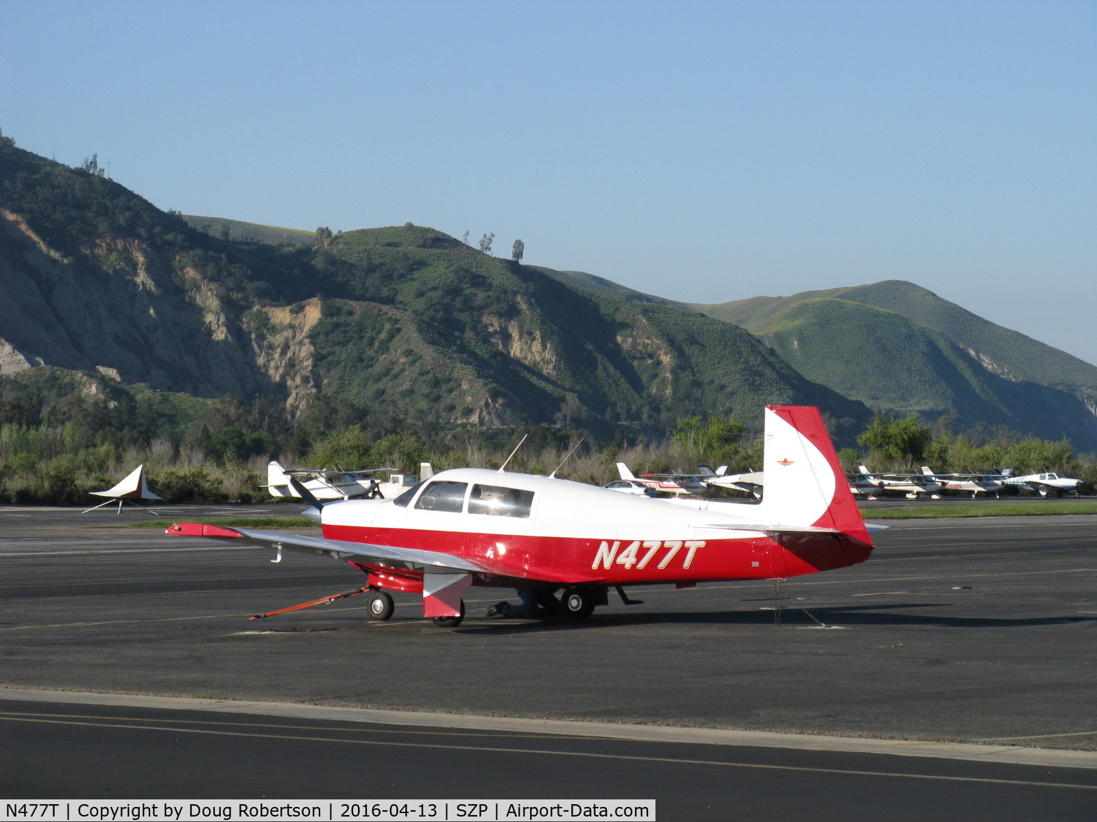 N477T, 1967 Mooney M20F Executive C/N 670274, 1967 Mooney M20F EXECUTIVE, Lycoming IO-360-A1A 200 Hp, Positive Control feature, long cabin, in prep for tug-tow to Ray's Aviation on field. Tug off photo to left...