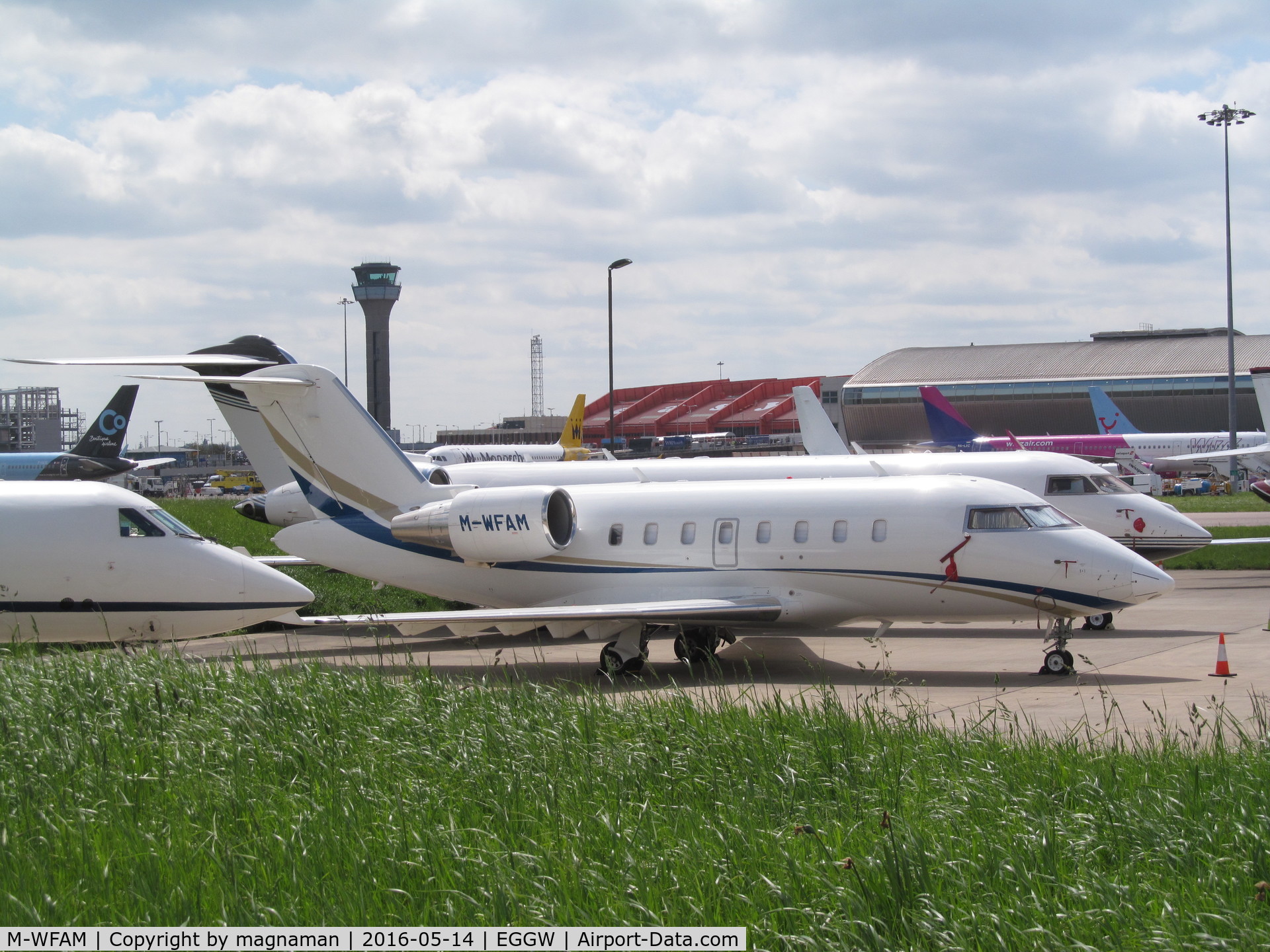 M-WFAM, 2012 Bombardier Challenger 605 (CL-600-2B16) C/N 5914, on apron at  luton