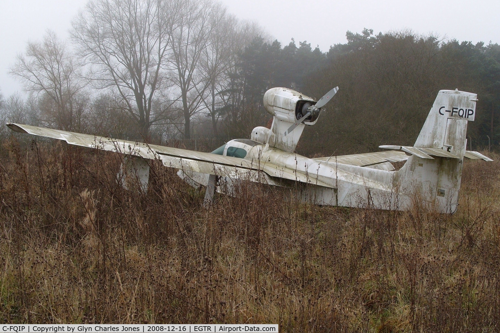 C-FQIP, 1975 Lake LA-4-200 Buccaneer C/N 679, Taken on a quiet cold and foggy day. Sadly looking rather shabby after being exposed to the elements for a very long period of time and is gradually being engulfed by the plant life around it.