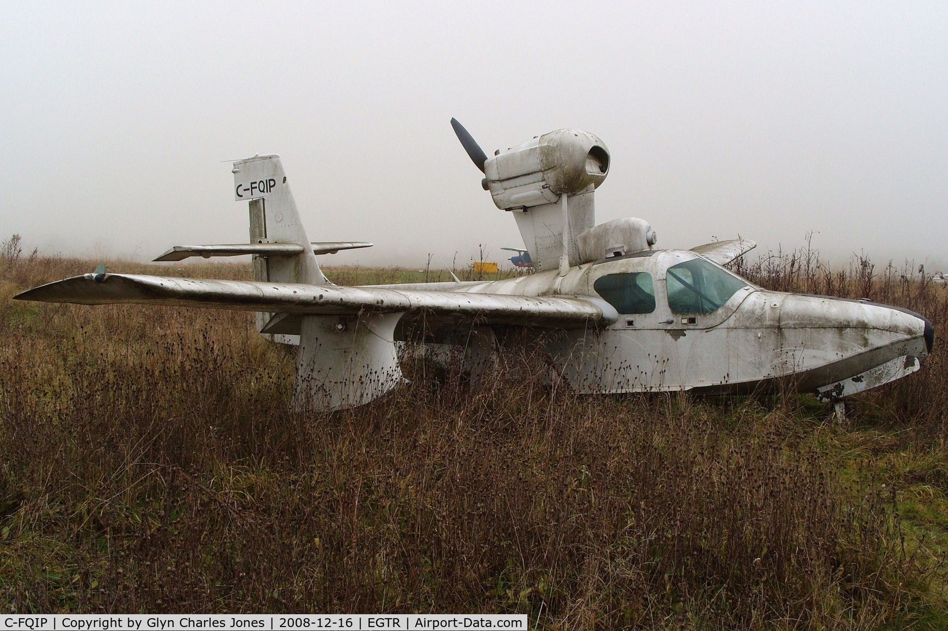 C-FQIP, 1975 Lake LA-4-200 Buccaneer C/N 679, View from the other side. Taken on a quiet cold and foggy day. Sadly looking rather shabby after being exposed to the elements for a very long period of time and is gradually being engulfed by the plant life around it.