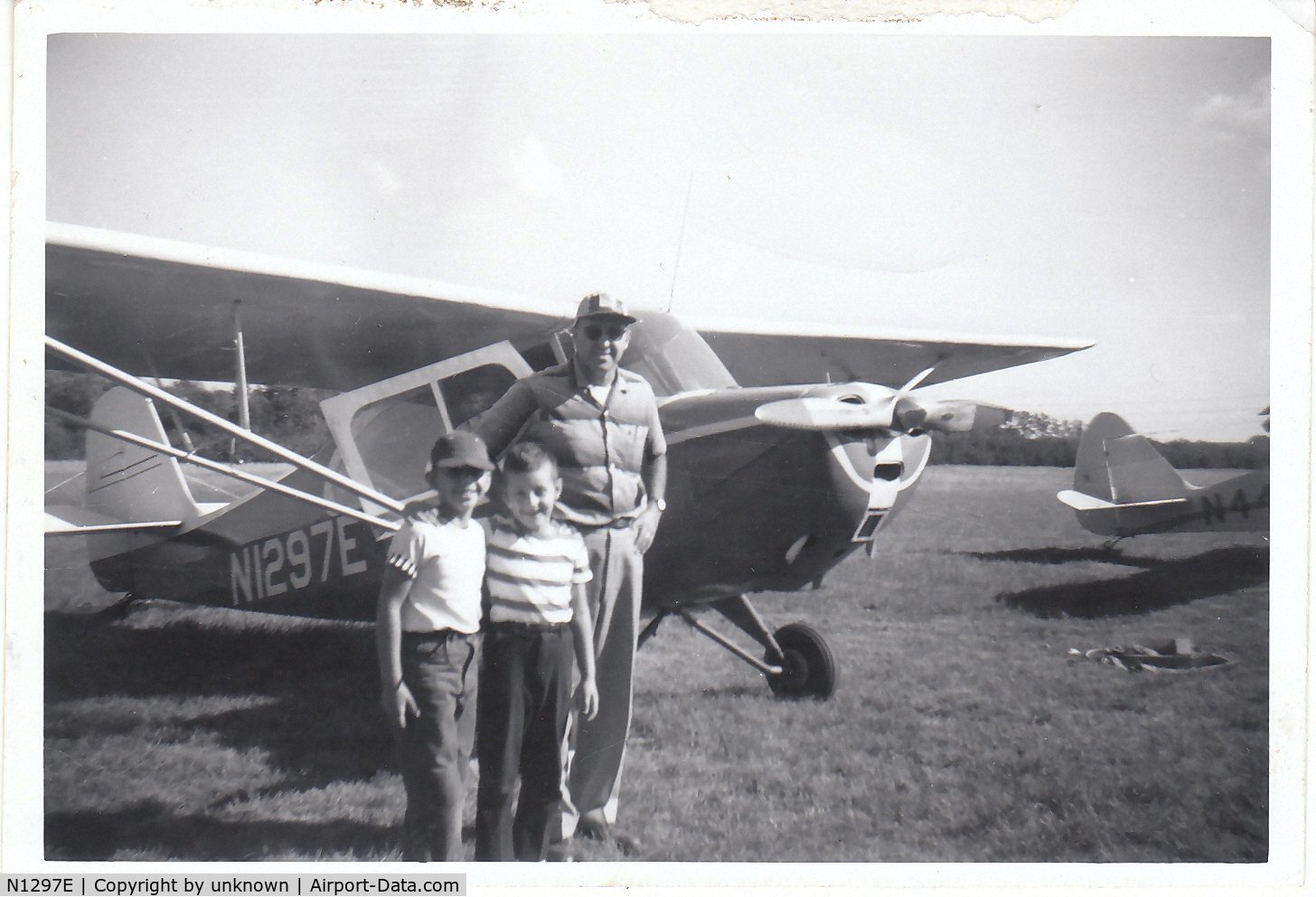 N1297E, 1946 Aeronca 7AC Champion C/N 7AC-4857, This was my Dad's plane back in the early 1960's my brother, myself and dad are in the picture - the photo was taken at an old airfield called Brizee-Harmon field owned at the time by Roy Harmon on Marsh Rd. just outside Rochester, NY