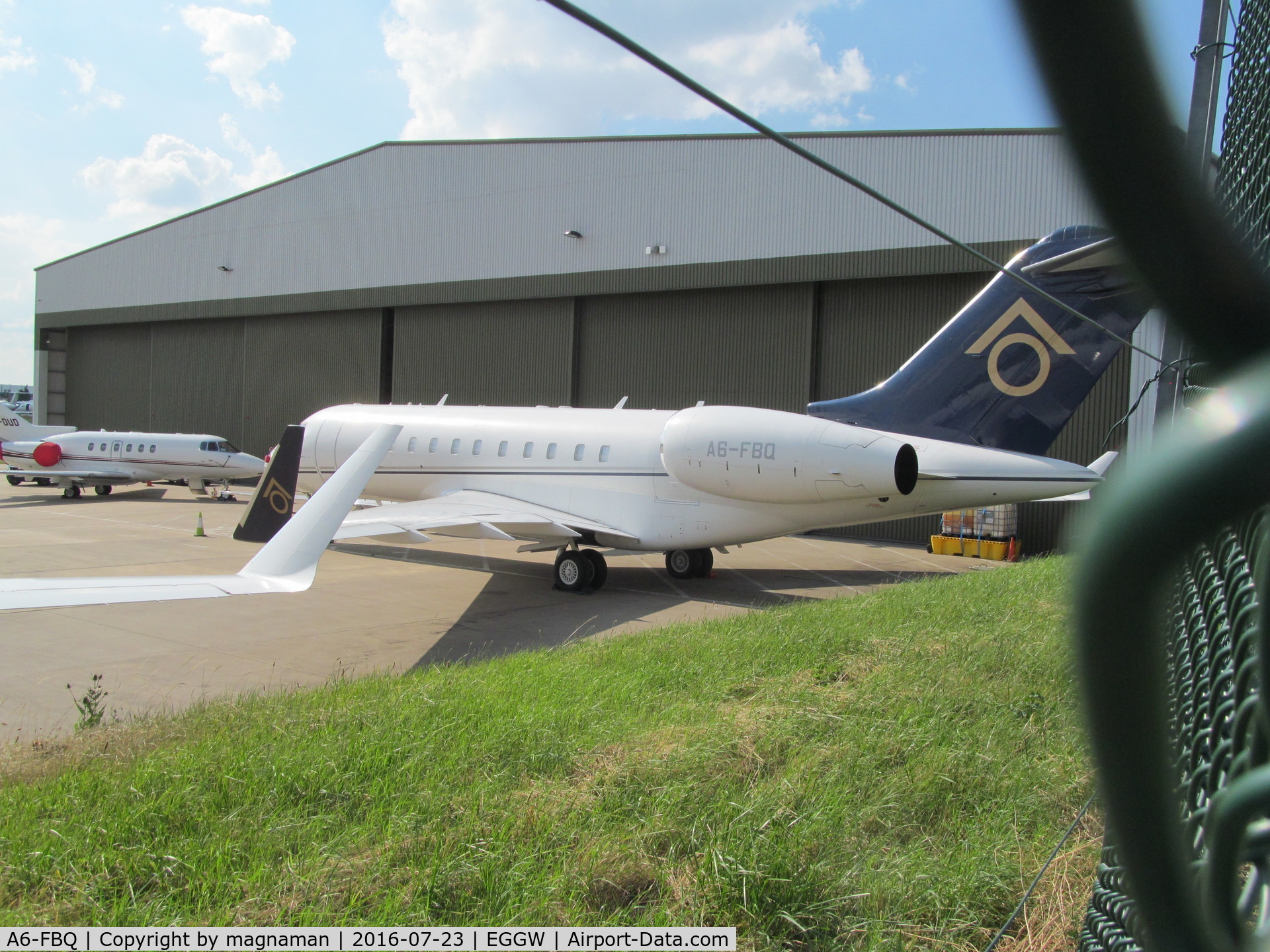 A6-FBQ, 2007 Bombardier BD-700-1A11 Global 5000 C/N 9282, at luton and fence
