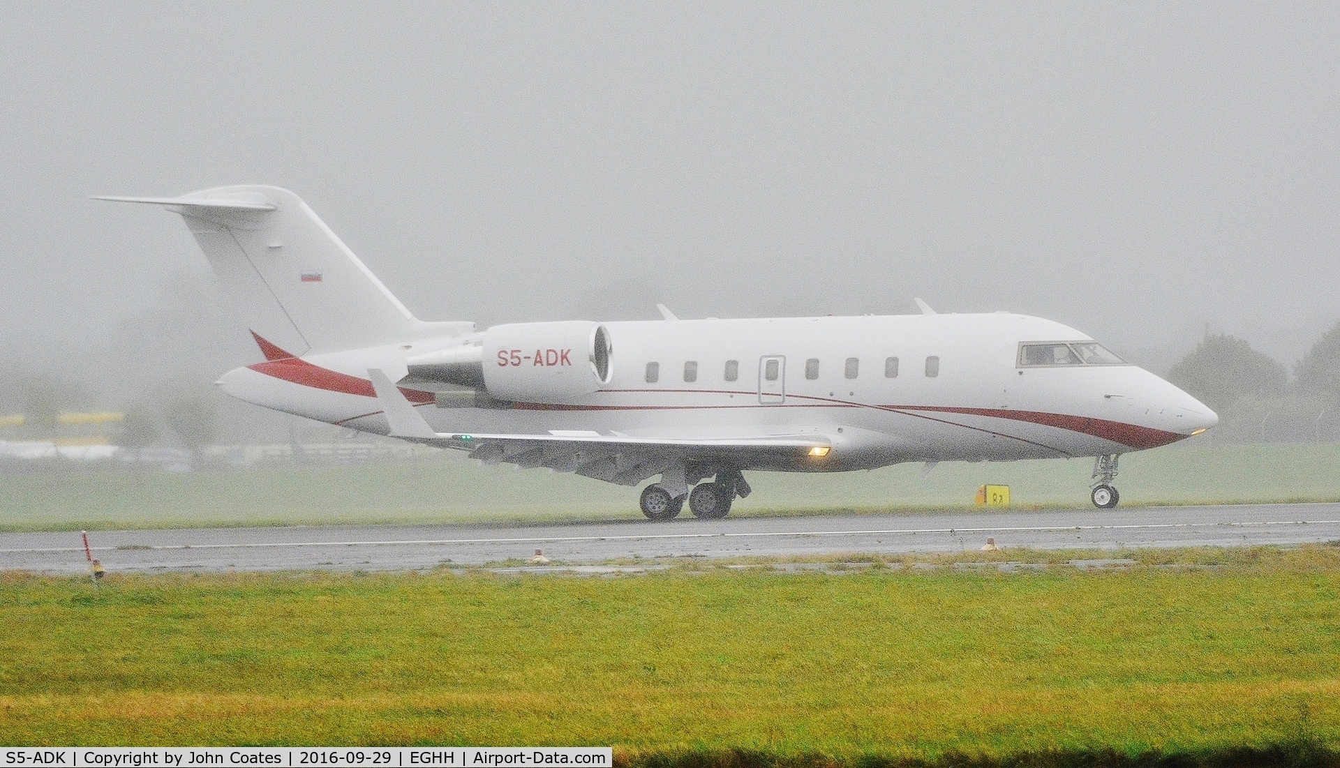 S5-ADK, 2010 Bombardier Challenger 605 (CL-600-2B16) C/N 5855, Early morning arrival through the mist and drizzle